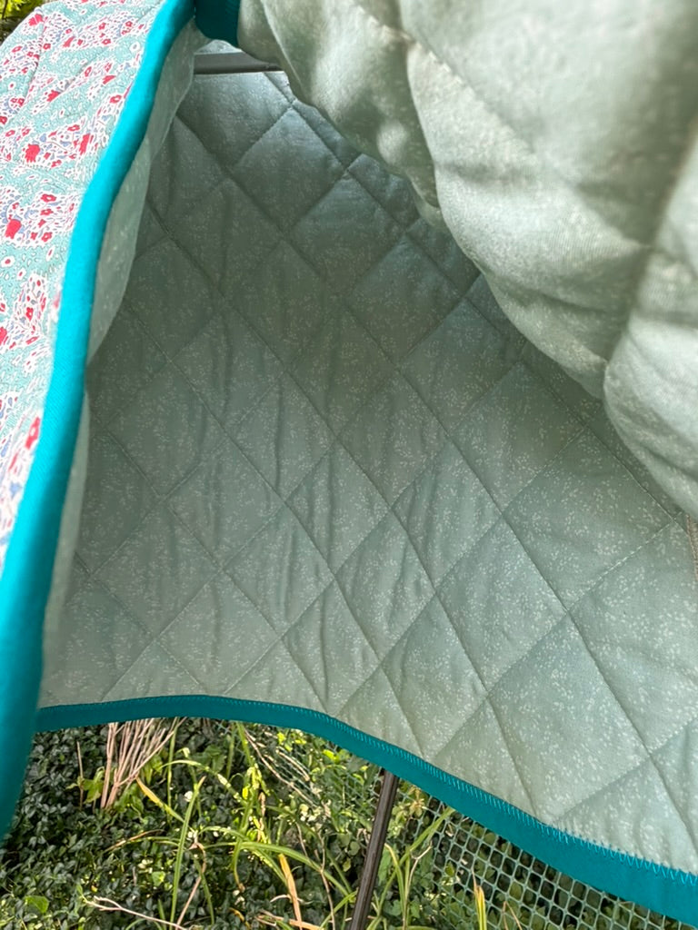 Interior lining of Teal Paisley Quilted Jacket size 4T — soft sage/mint green quilted cotton with diamond pattern and teal binding edge