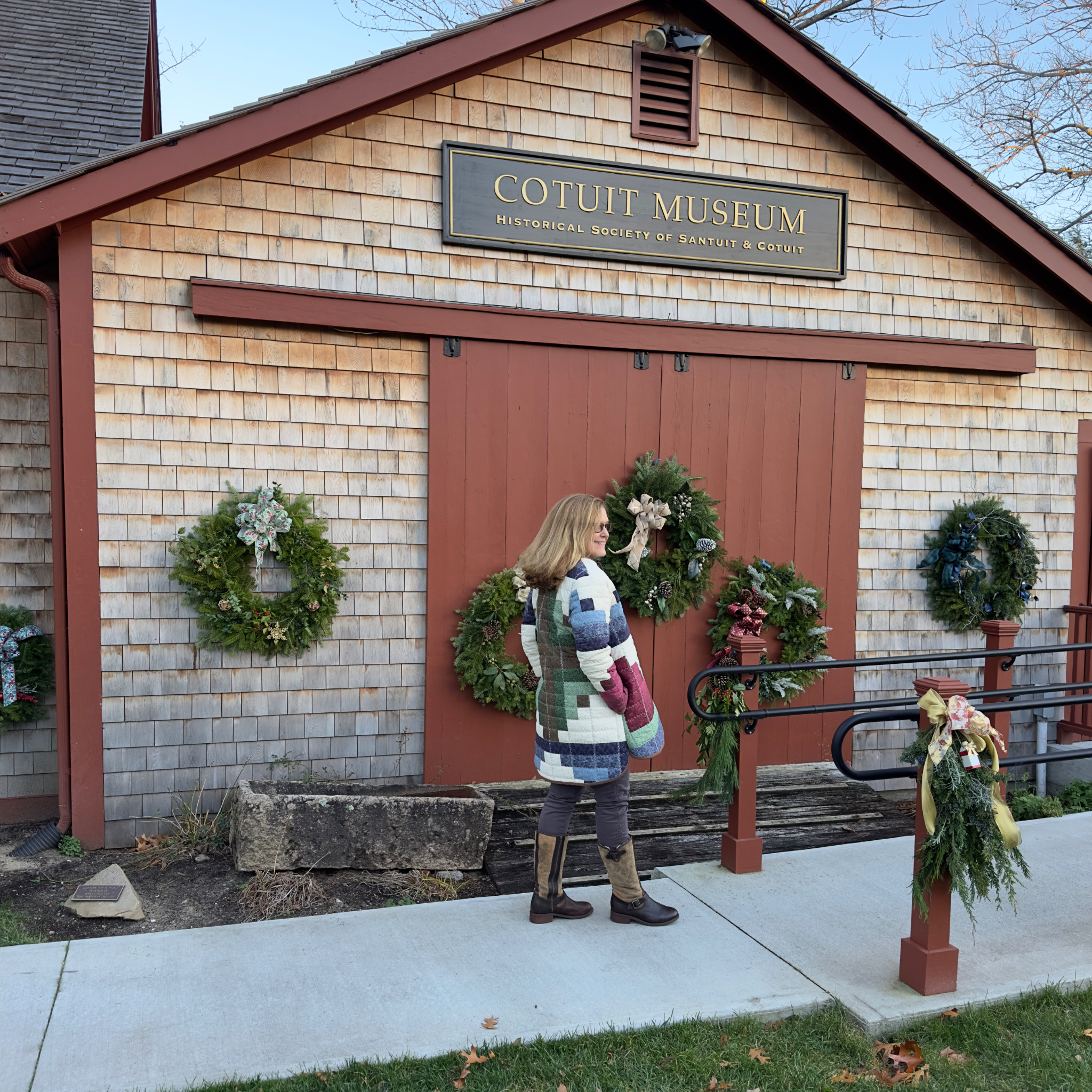 Side view showing coat length and quilted texture