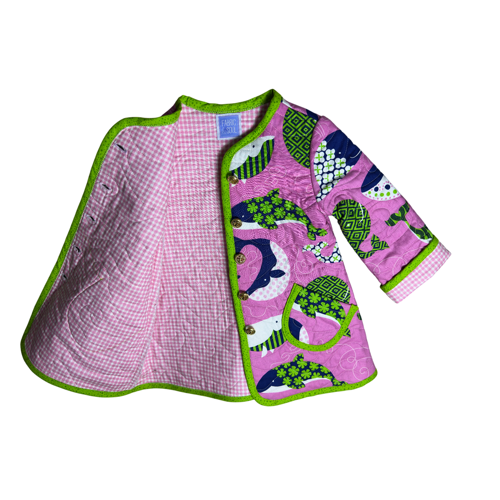 Children's nautical jacket with pink checkered interior and green border, featuring animal patterns on the exterior.