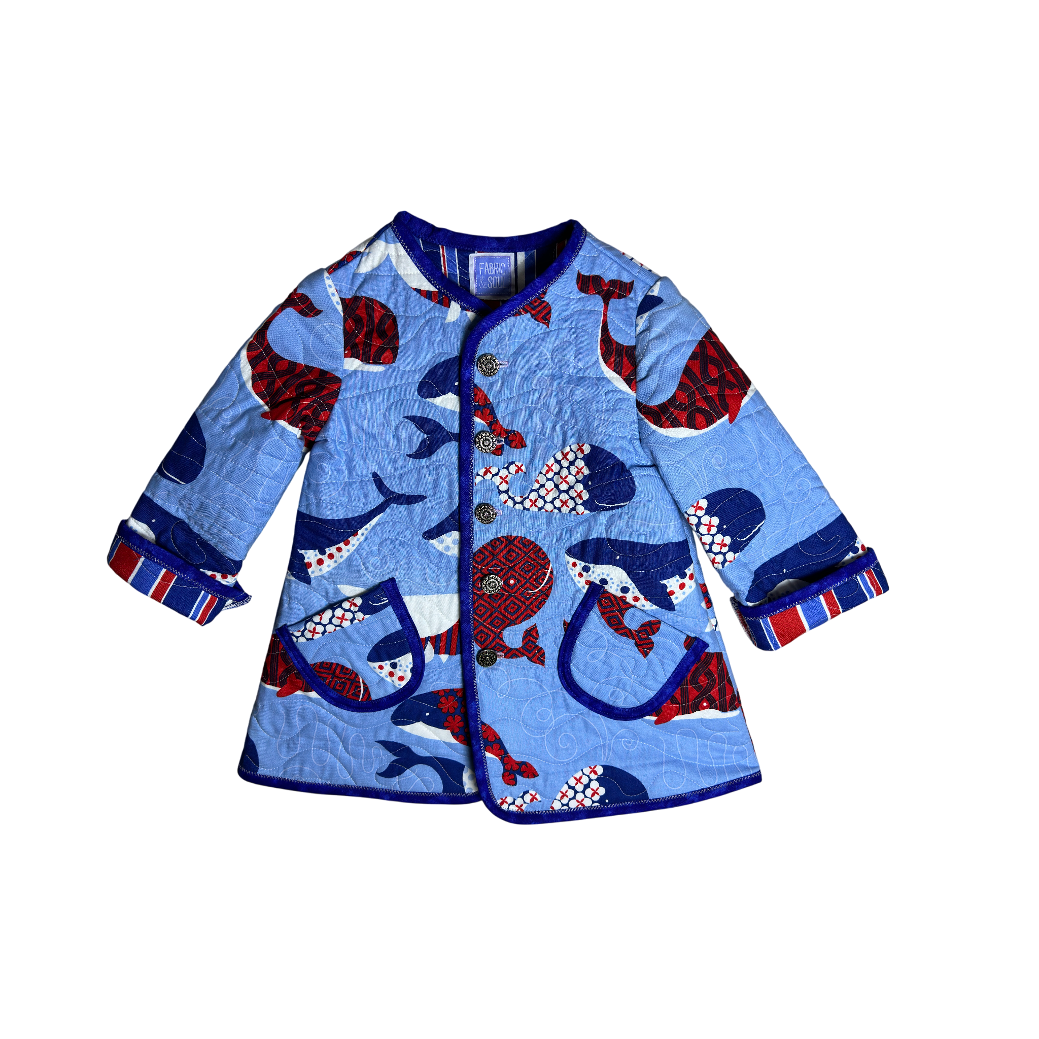 Handmade blue nautical children’s quilted coat with whale print and navy binding