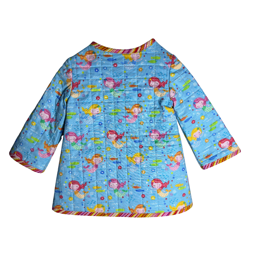 Back view of blue cotton kids jacket with mermaids, fish, shells, and starfish, quilted and cozy