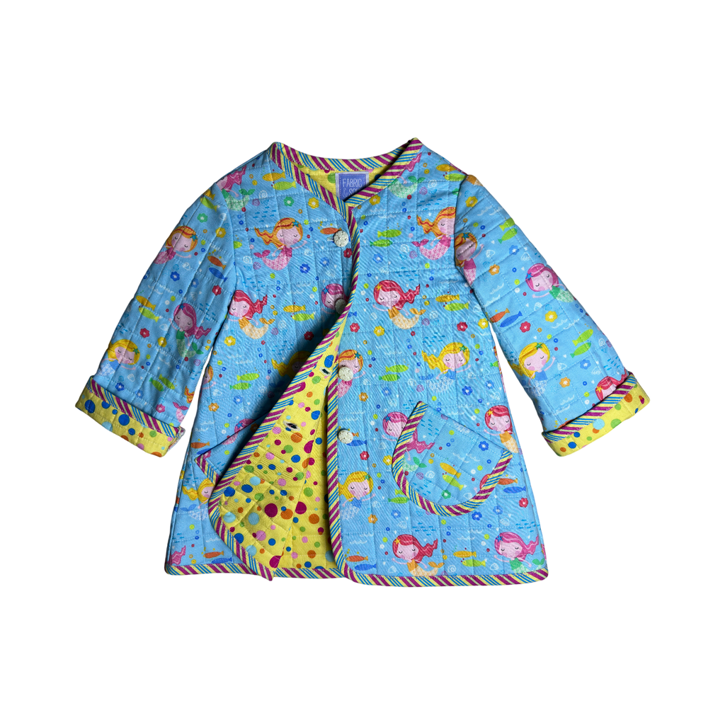 Children's coat showing polka dot lining