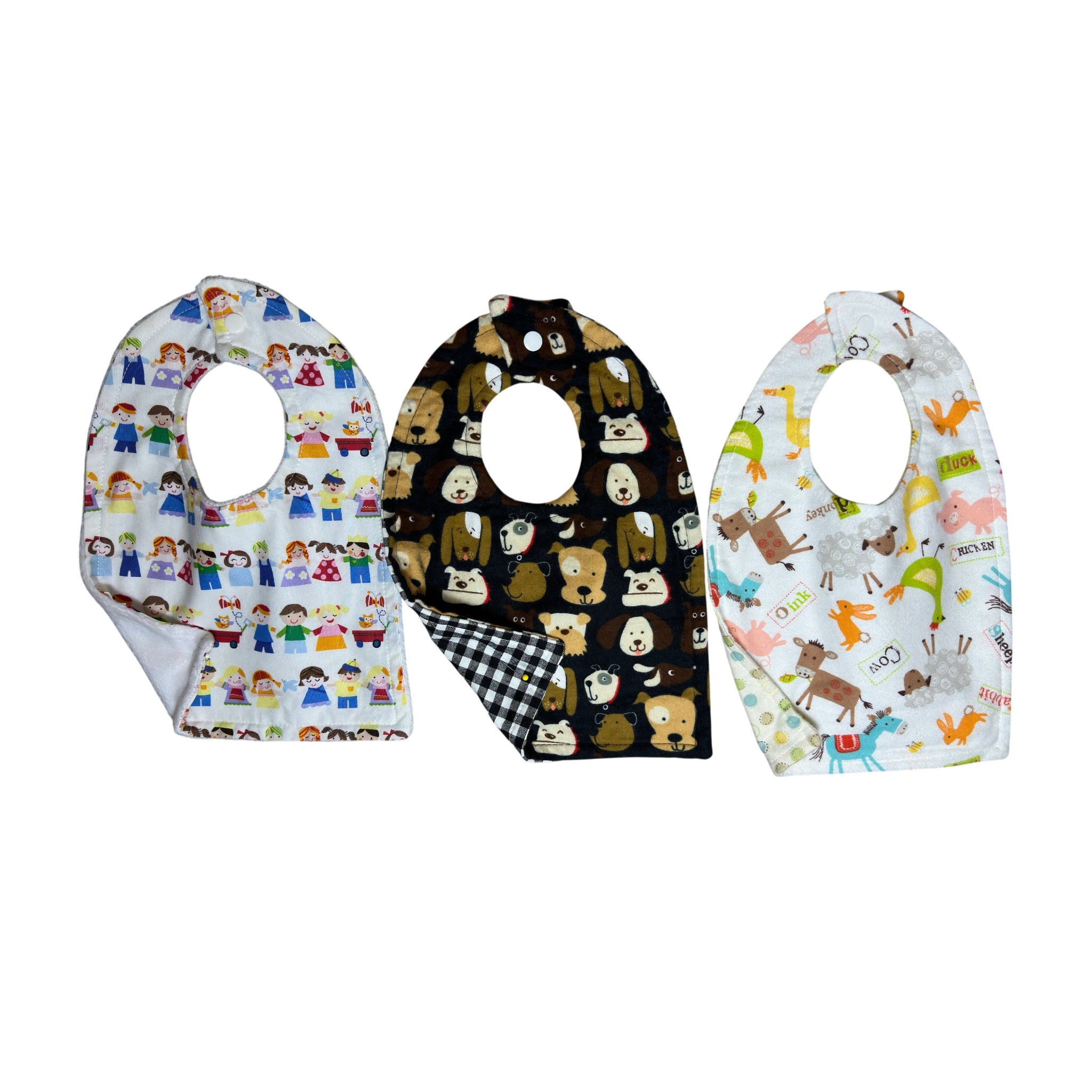 Handmade baby bib set of three with whimsical dogs, children at play, and colorful farm animals on quilting cotton