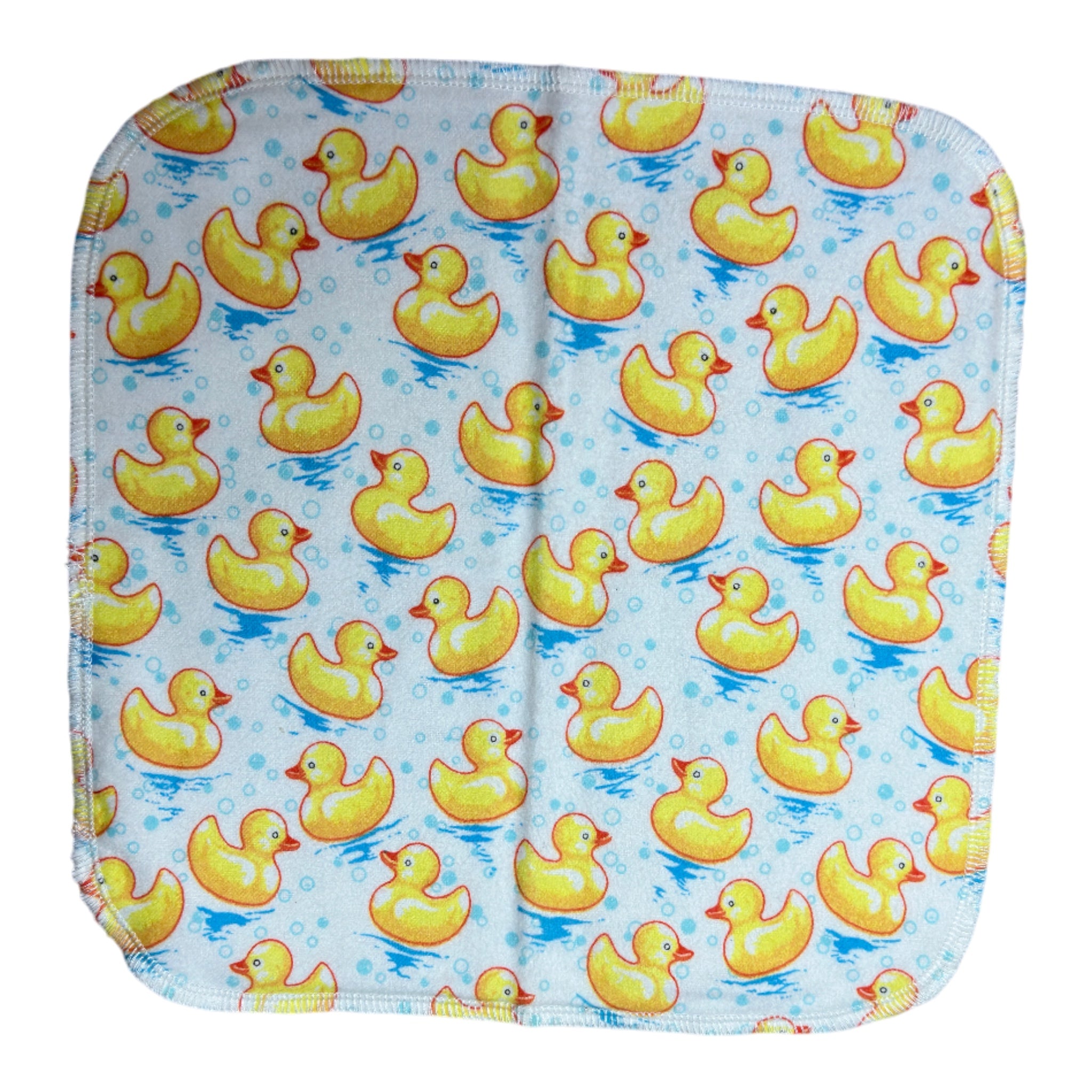 Handmade flannel baby burp cloth with yellow rubber ducks on blue water with bubbles