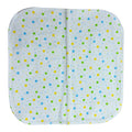 Handmade flannel baby burp cloth with blue, yellow, and green drops on white