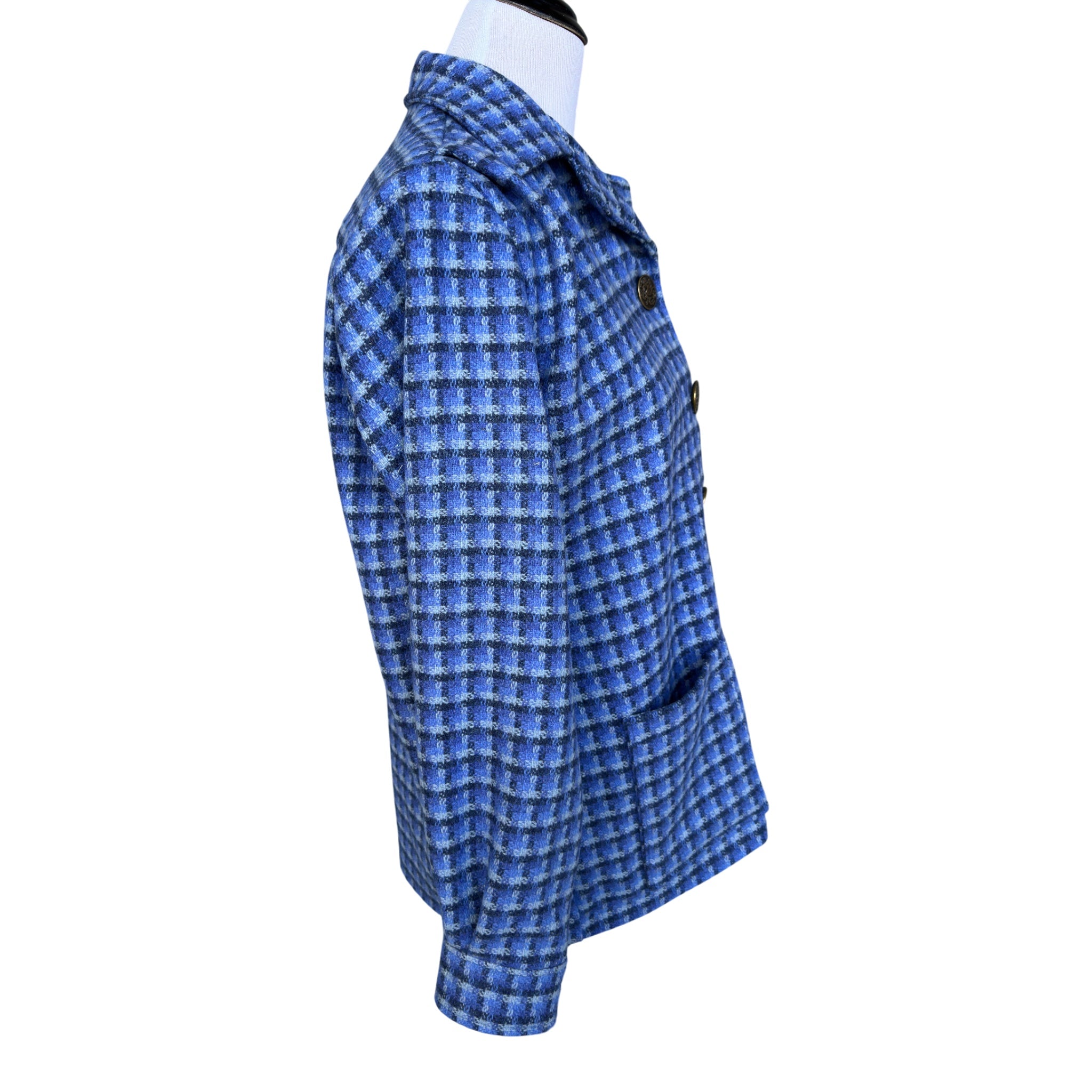 Side view of women’s jacket with French placket and peaked lapels
