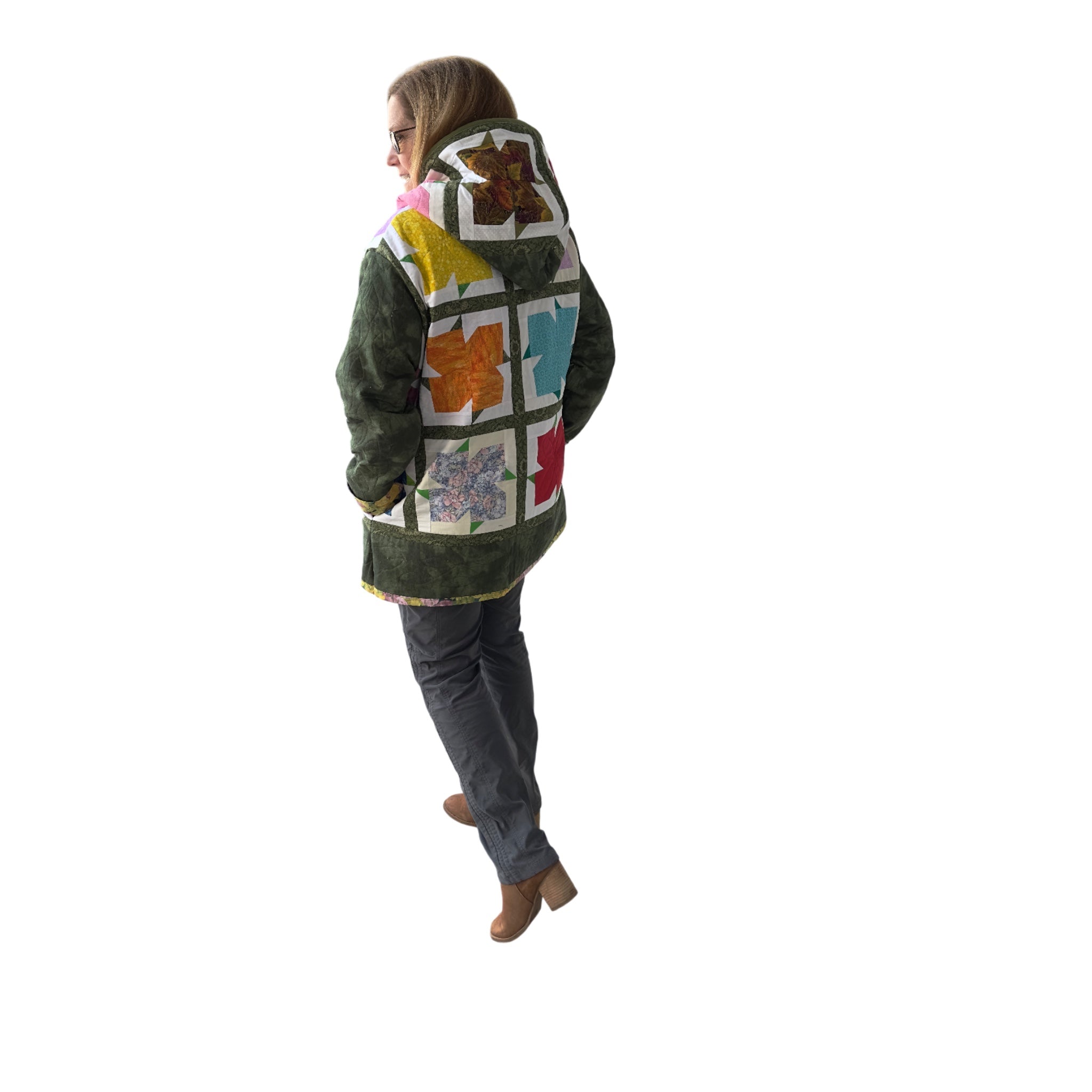 Model wearing multicolor quilted jacket showing hood and hands in pockets