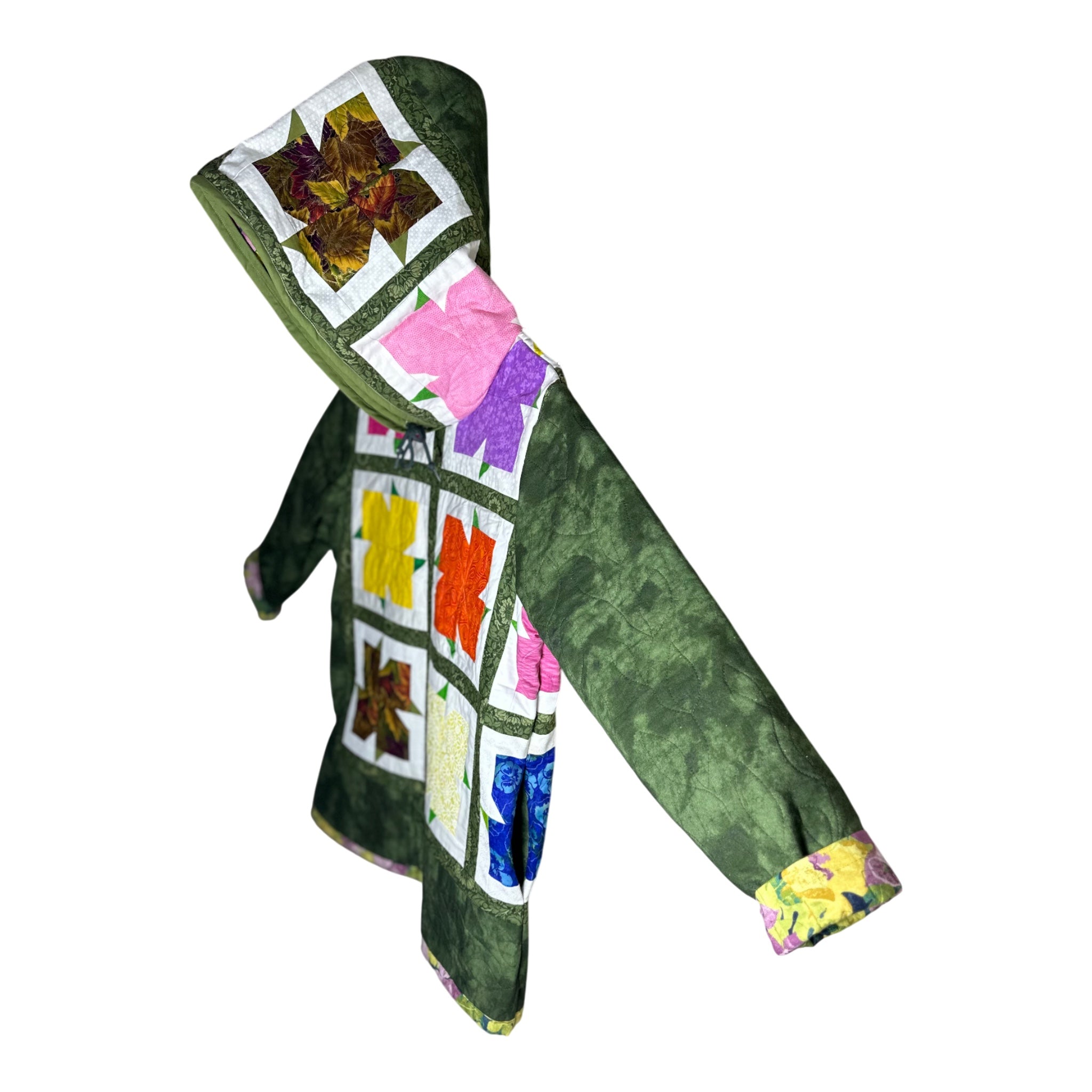 Right side of jacket with hood and sleeves rolled up to show backing showing pocket and quilting detail
