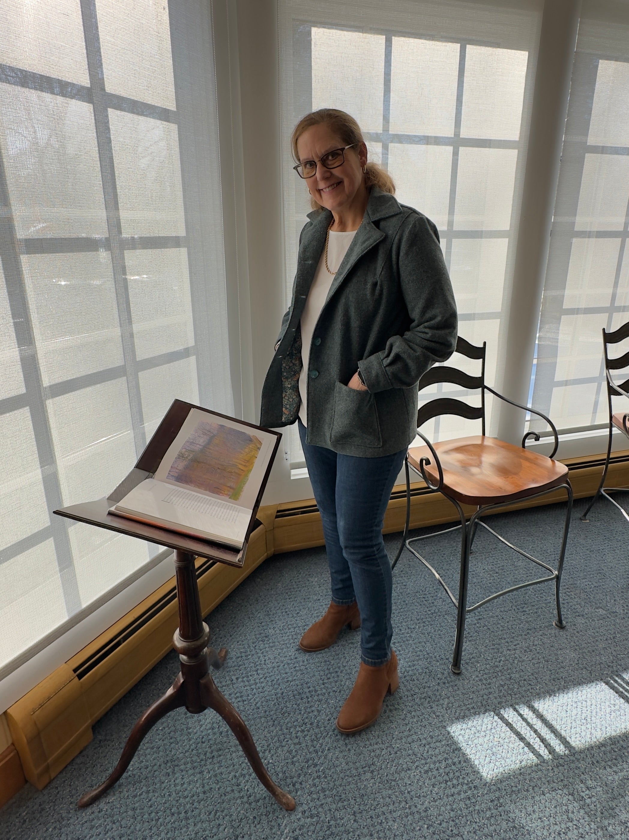 Wool jacket on model showing pockets and linking from side view. 