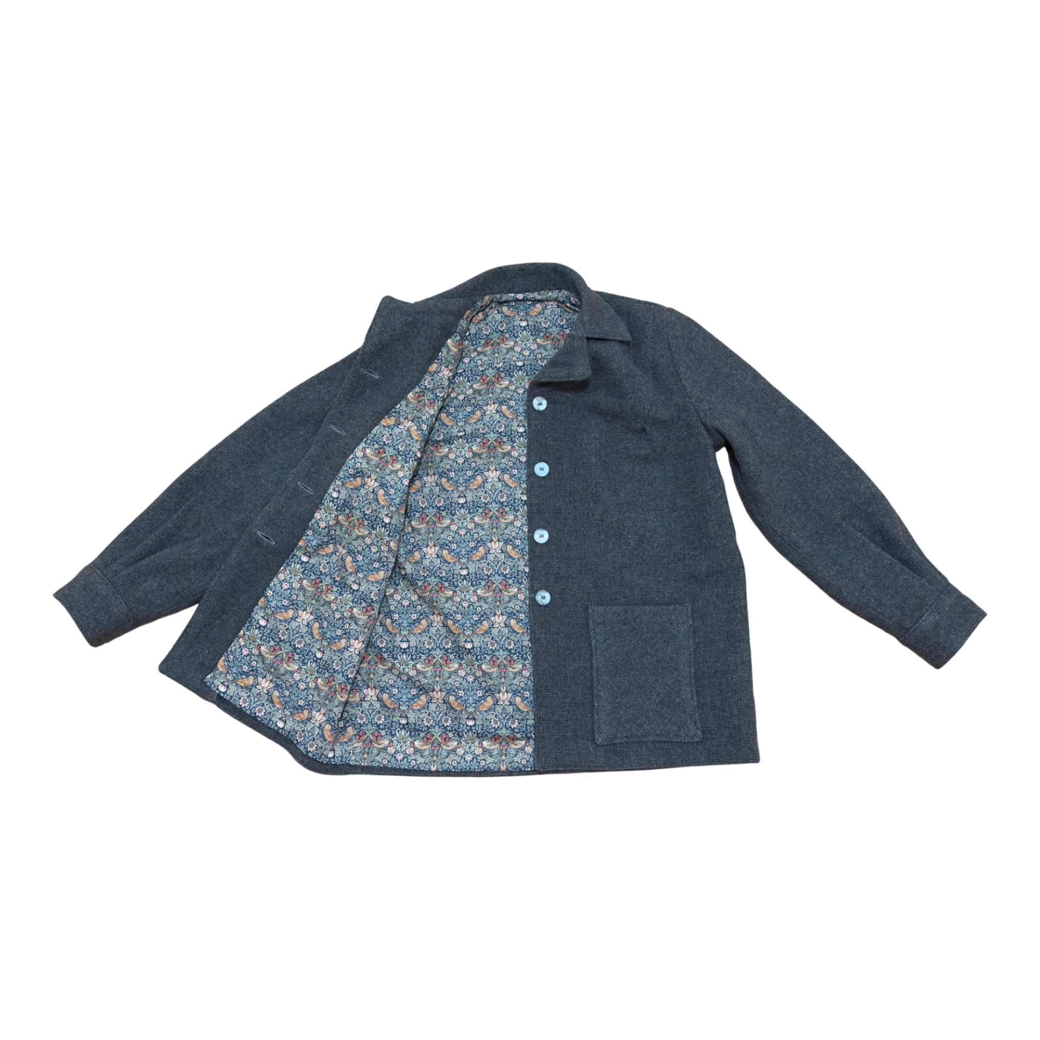 Fabric & Soul made jacket from virgin wool blue fabric showing lining and blue vintage buttons. 