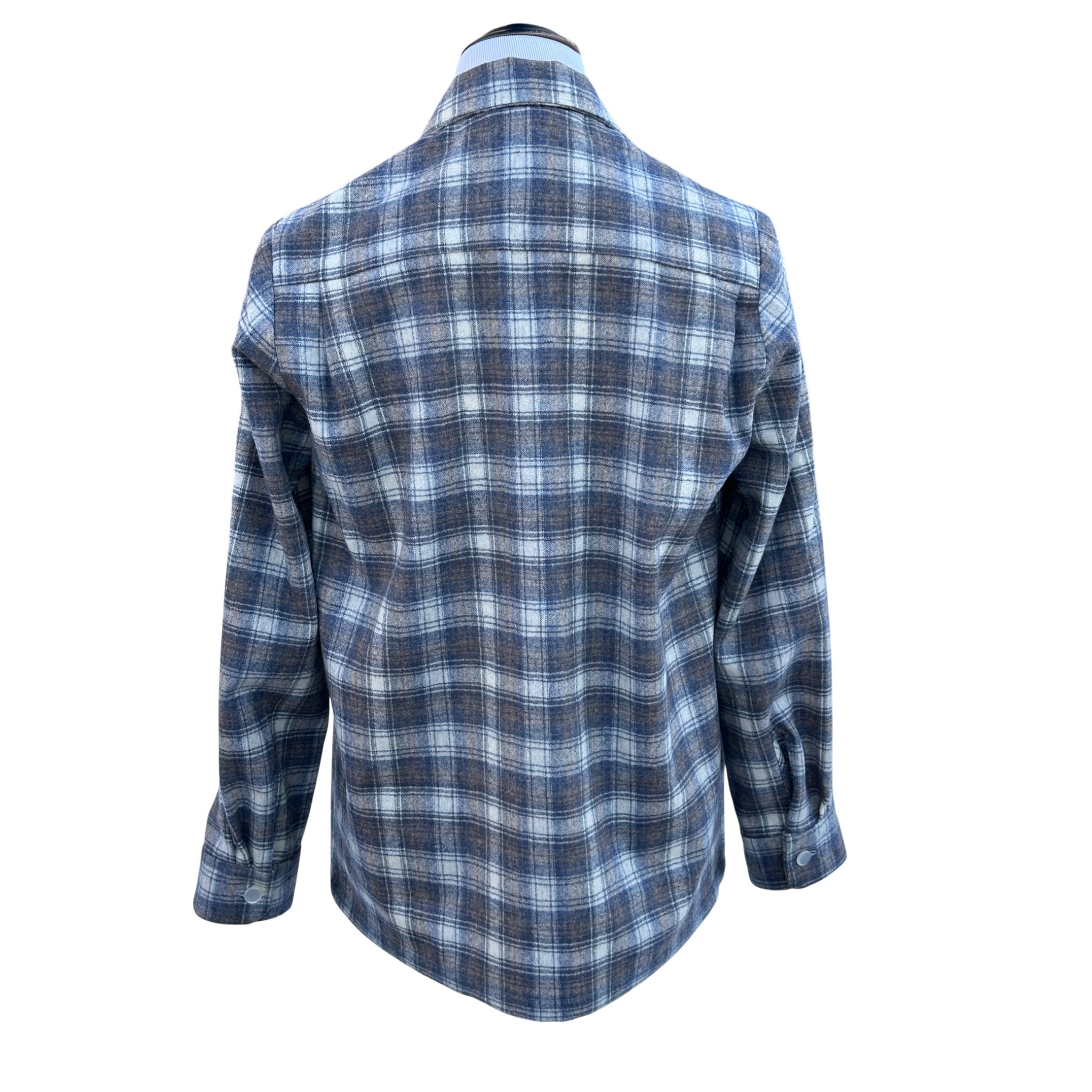 Handmade plaid wool jacket back detail - showing back pleats and cuff buttons on wool fabric