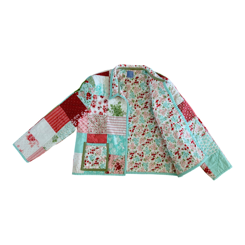 Patchwork jacket with floral and patterns on a white background showing lining fabric 