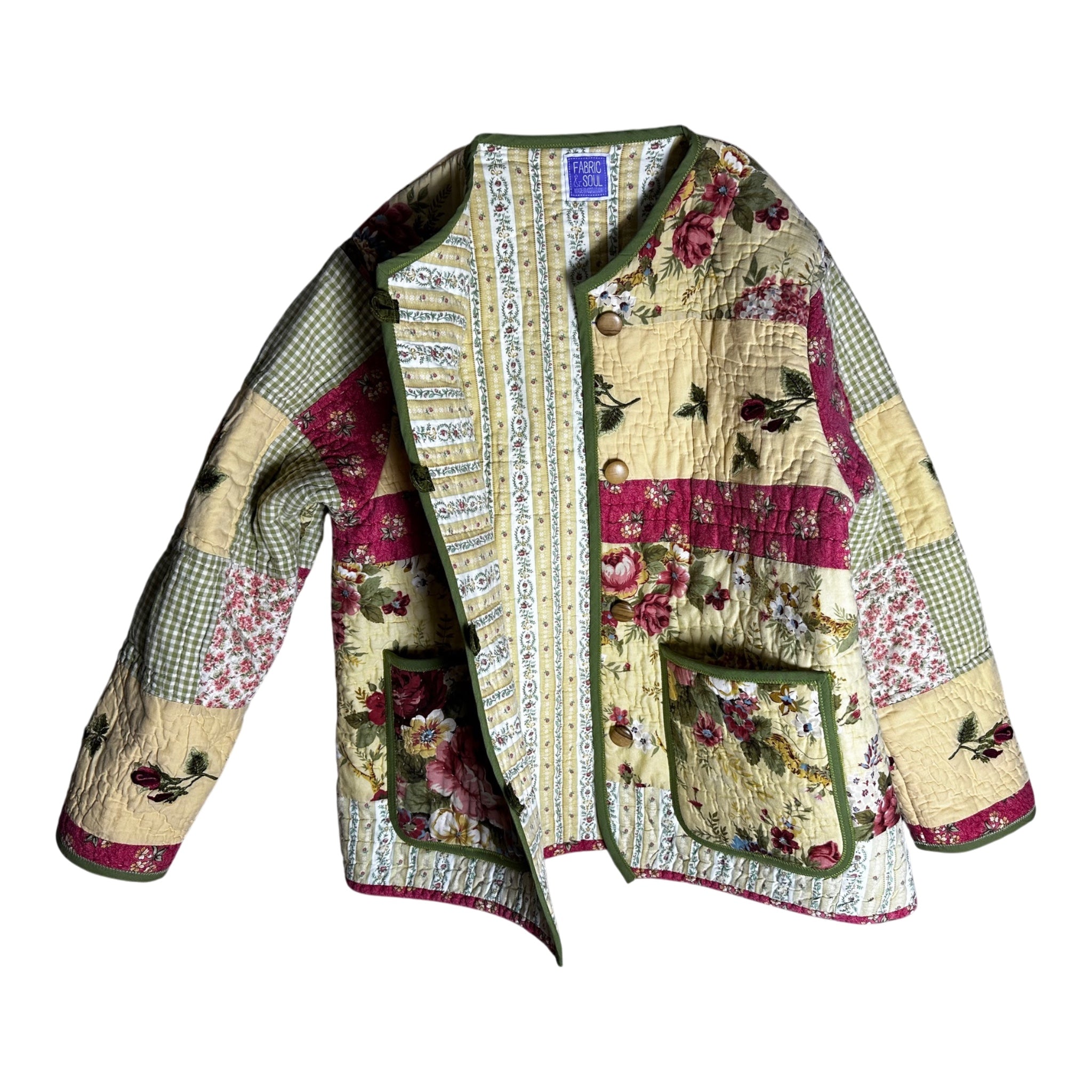 Inside view of floral patchwork jacket showing lining  and wooden buttons made by Fabric & Soul.