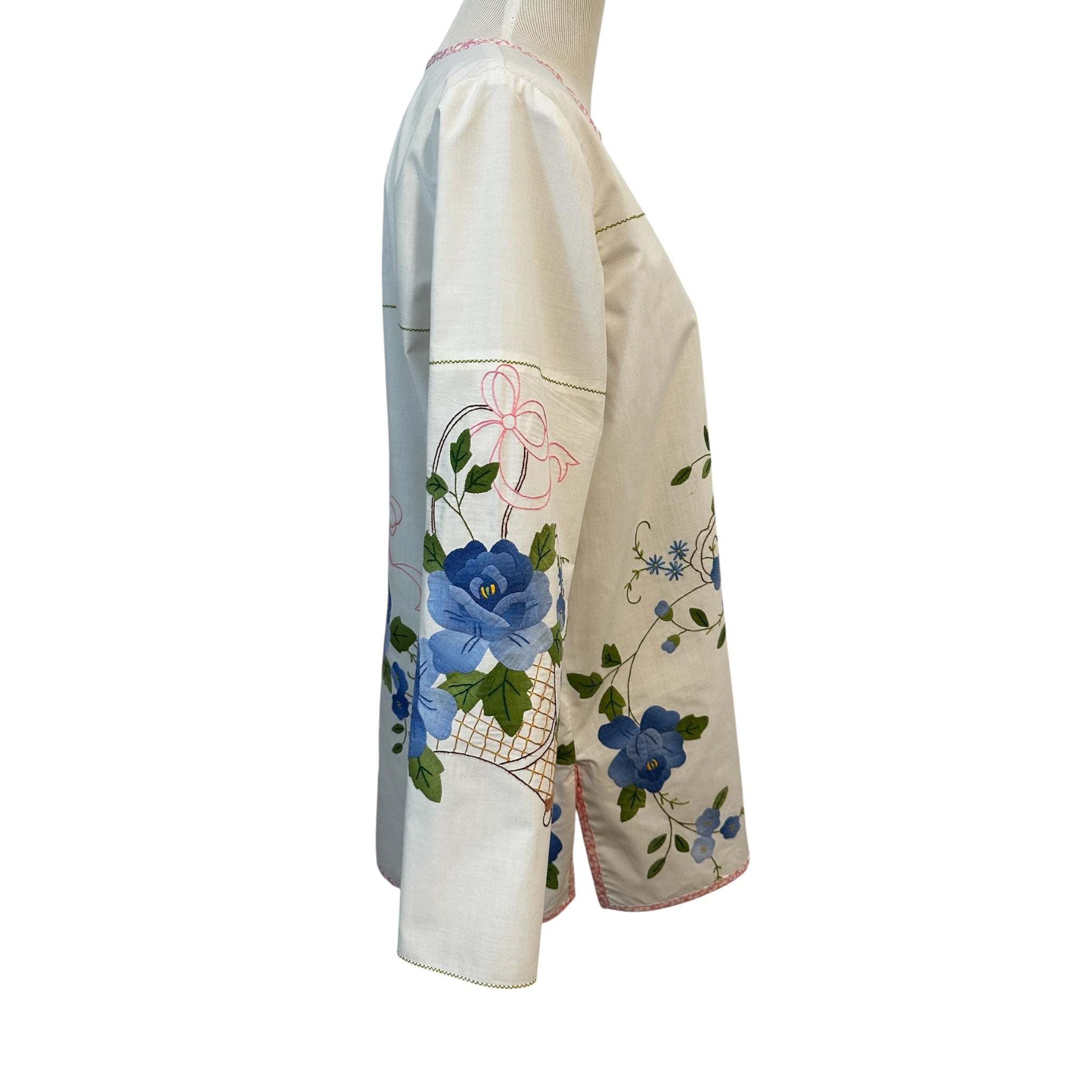 Right side view of vintage blue floral basket tunic showing sleeve appliqué placement and side slit — handcrafted cotton top by Fabric & Soul