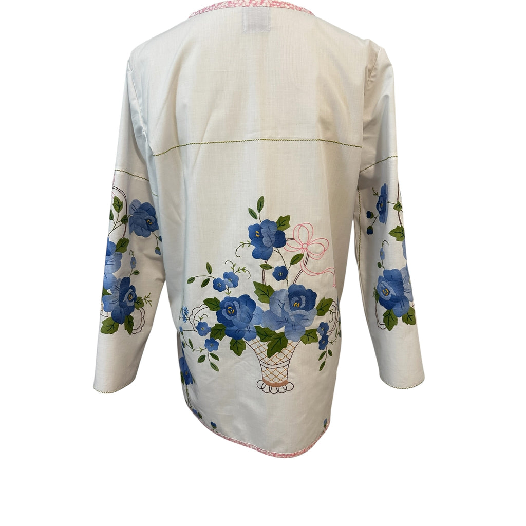 Back view of handmade white cotton tunic with blue floral basket appliqué centered on back — French felled seams, slow fashion by Fabric & Soul
