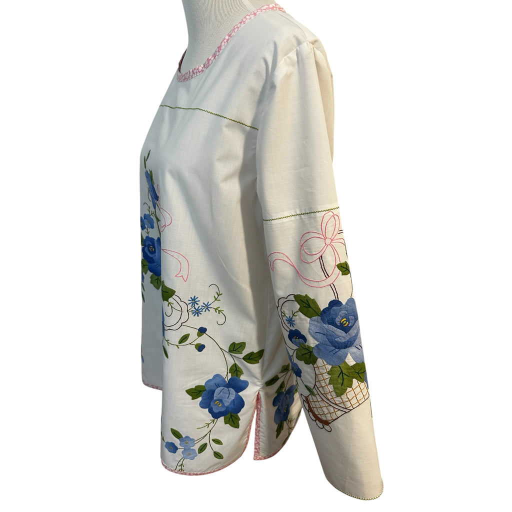 Left side view of vintage blue floral basket tunic showing sleeve appliqué placement and side slit — handcrafted cotton top by Fabric & Soul