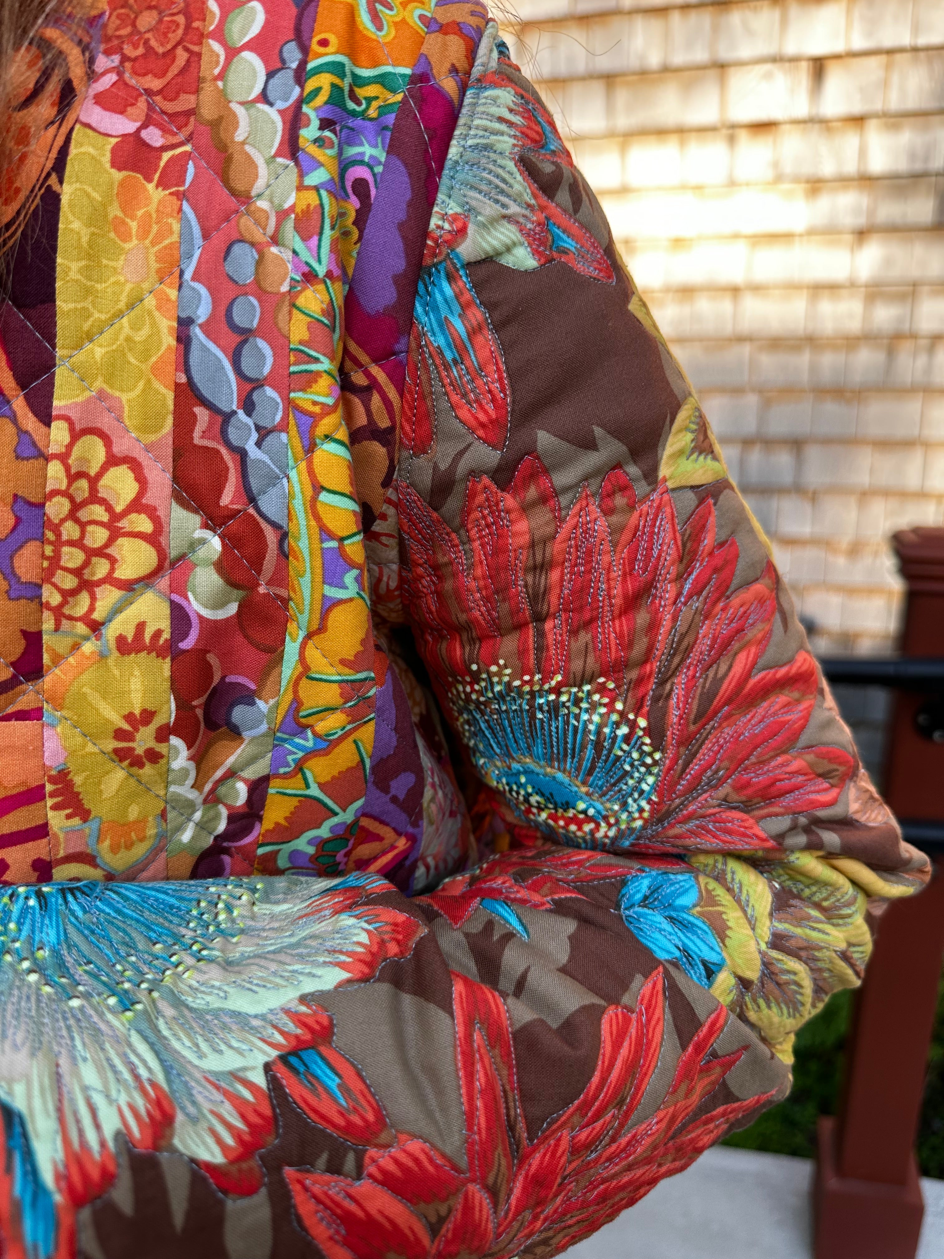 Quilted coat with Kafee Fassett fabric— lining and sleeve thread painting/quilting detail, handmade in Cotuit by Fabric & Soul