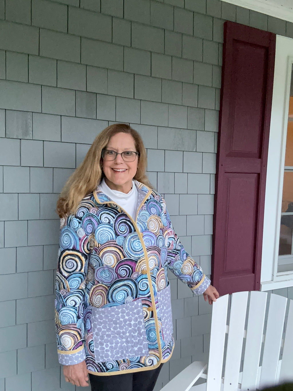 Women's Large handmade quilted coat front view, Kaffe Fassett swirling shell cotton with stone-pattern pocket, one of a kind