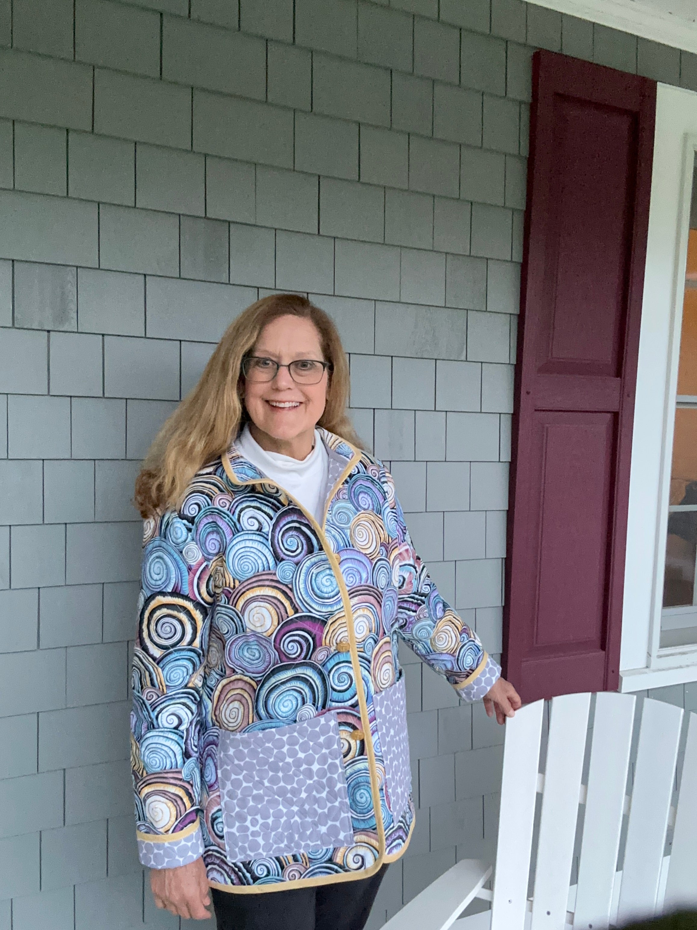 Women's Large handmade quilted coat front view, Kaffe Fassett swirling shell cotton with stone-pattern pocket, one of a kind