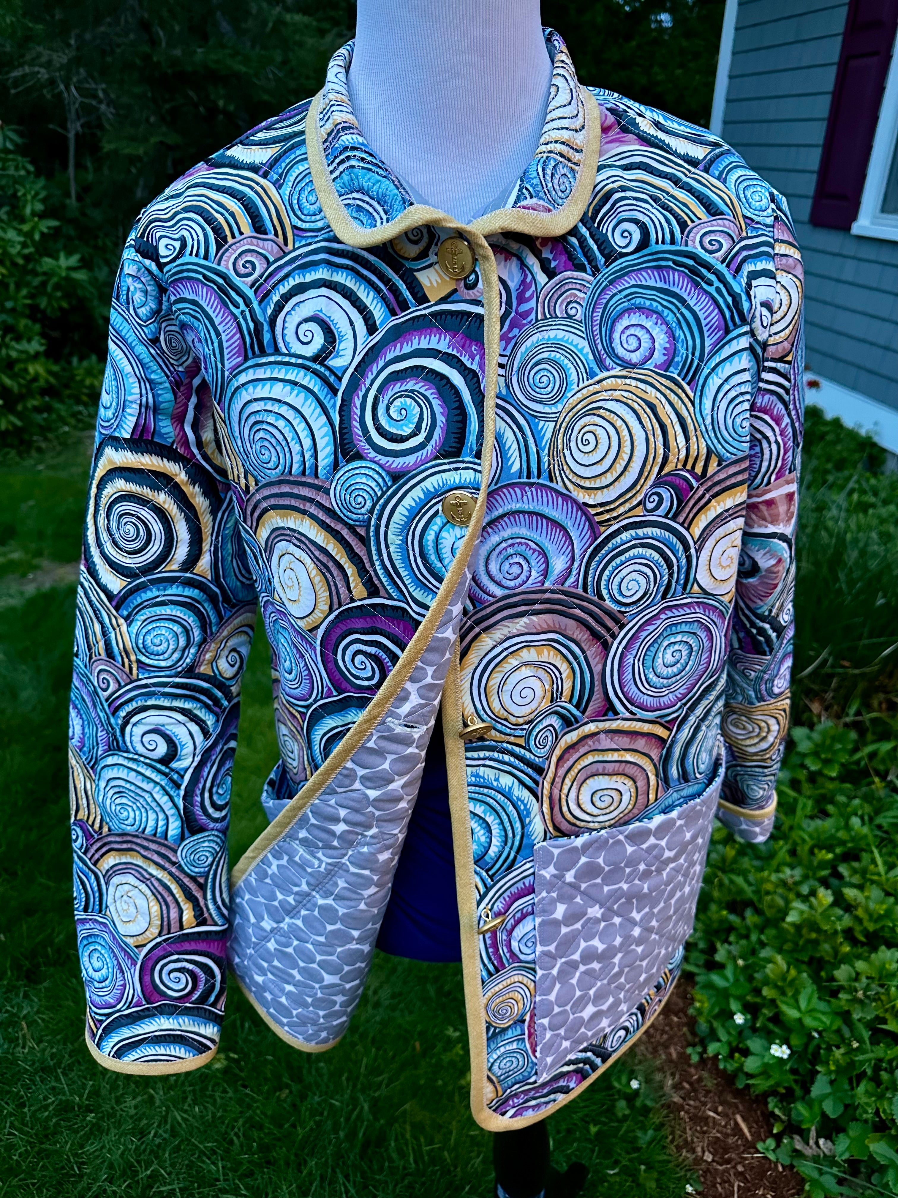Handmade women's quilted coat open front showing stone-pattern cotton lining and sandy-gold binding, one of a kind wearable art