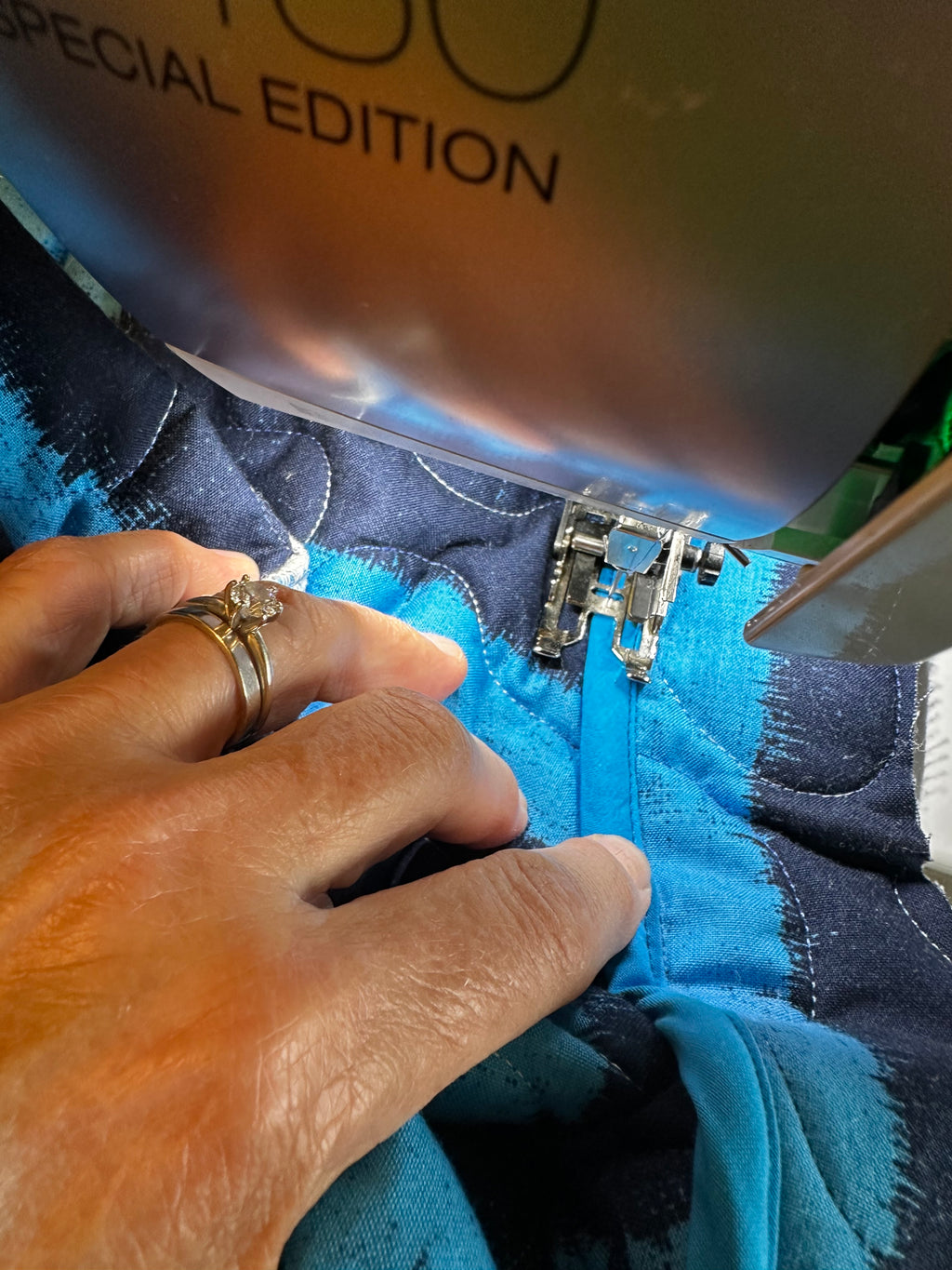 Handmaking coastal blue quilted jacket showing stitching detail by Fabric & Soul