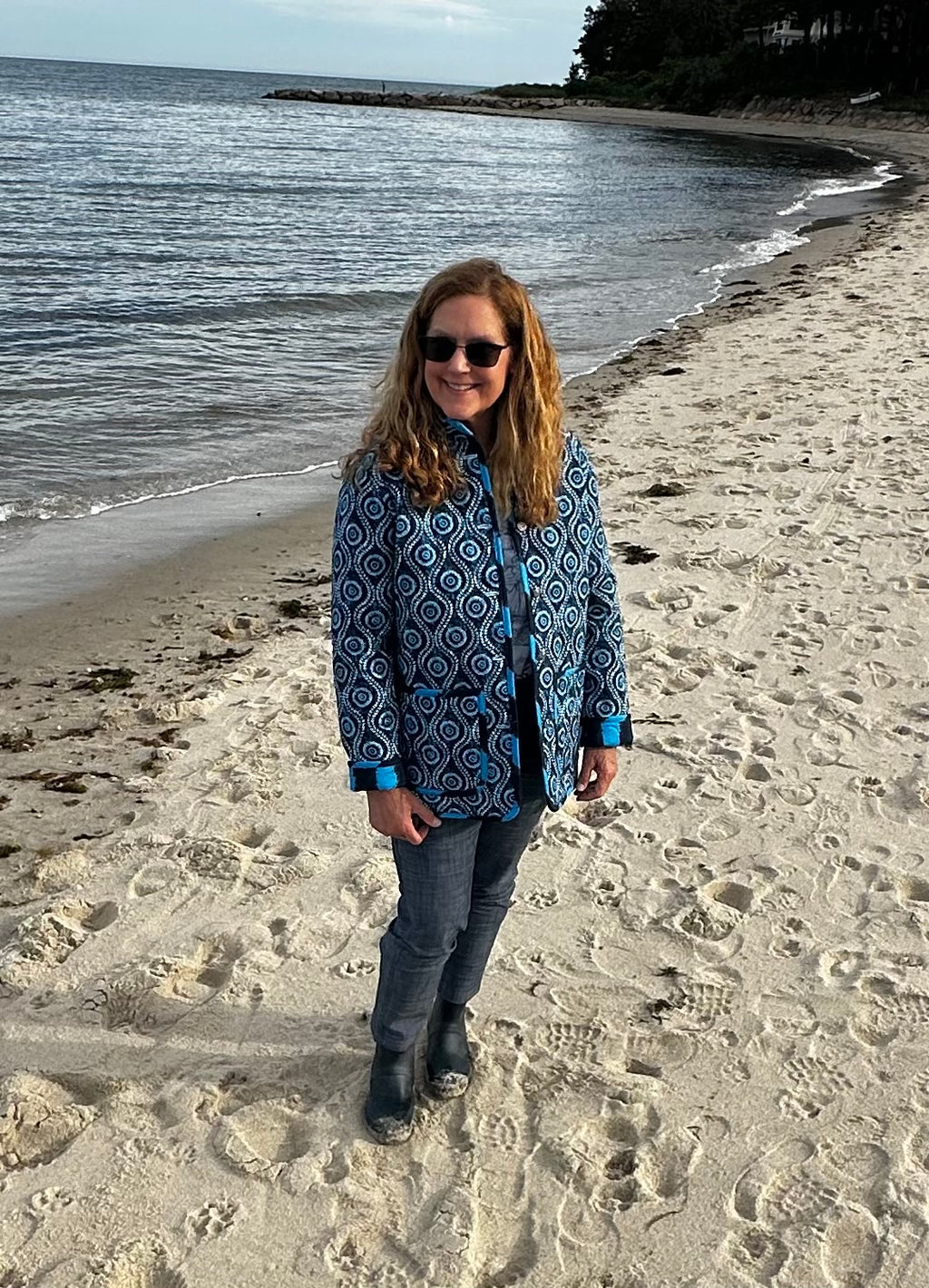 Handmade coastal blue quilted jacket laid flat, full length view, Fabric & Soul