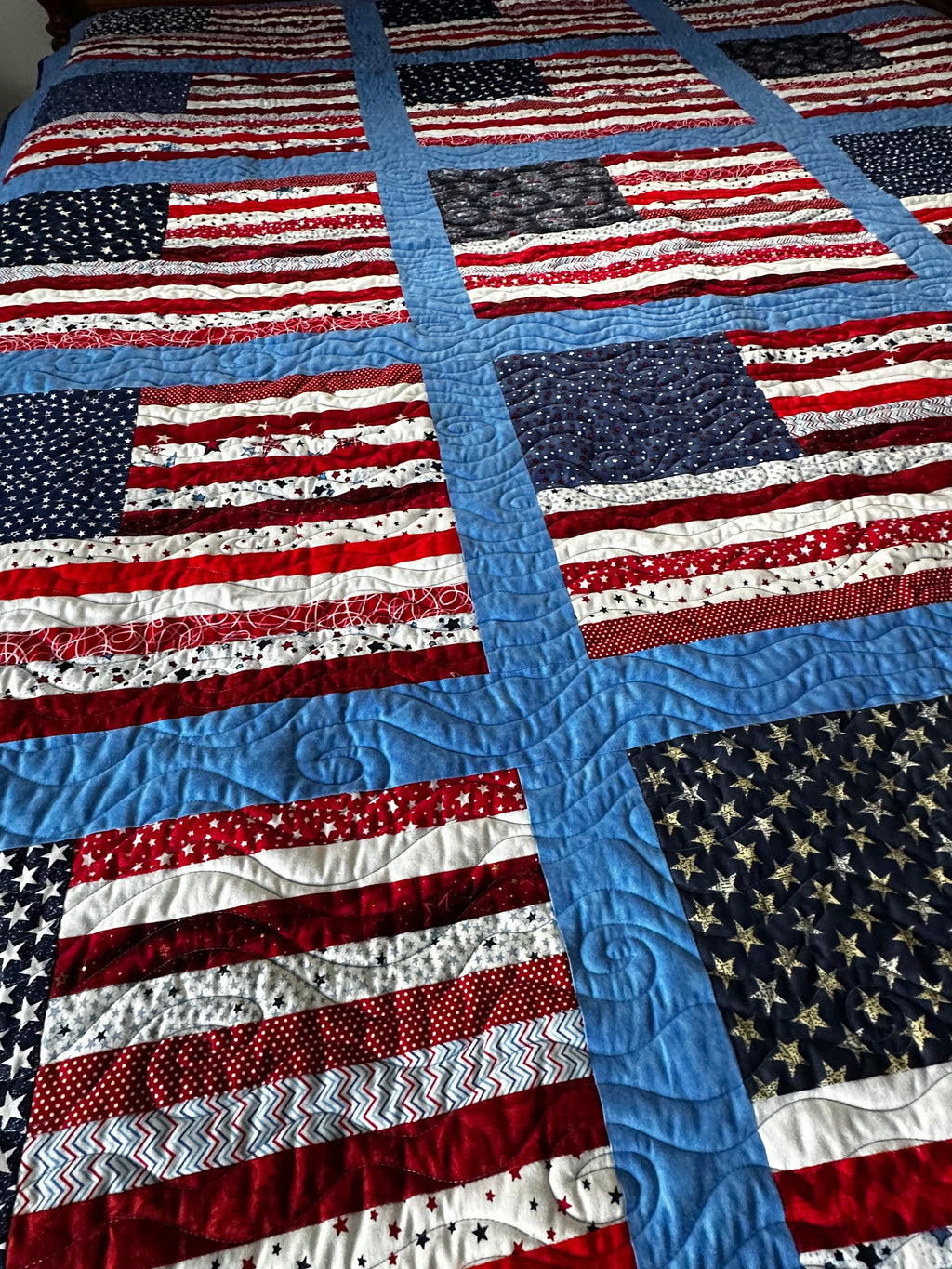 Quilting detail with American flag pattern featuring red, white, and blue colors