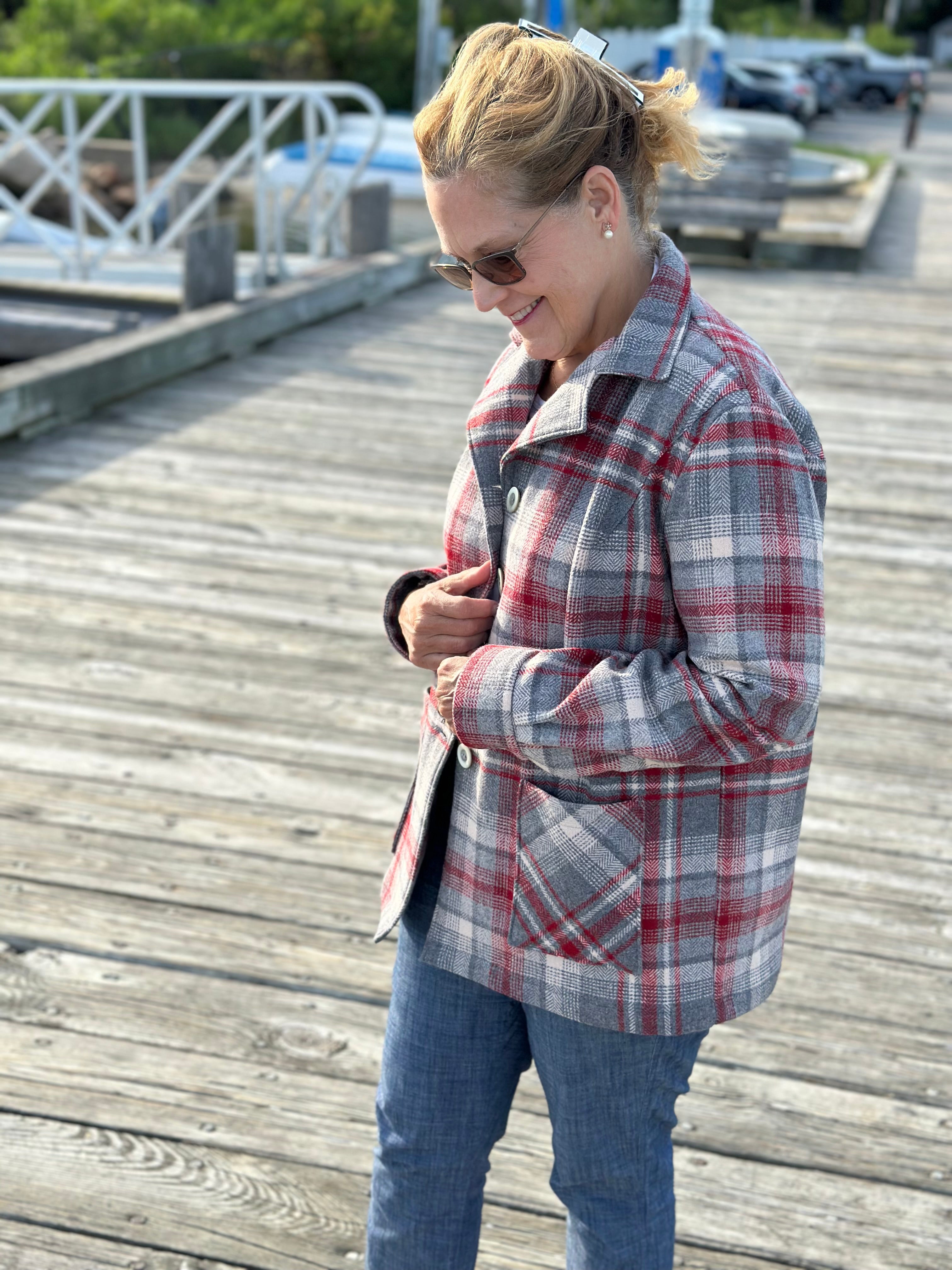 Heritage Oregon Wool Shirt Jacket back view in crimson and gray plaid wool, standing on a Cotuit Harbor dock. Handmade by Fabric & Soul in Cotuit, Cape Cod.