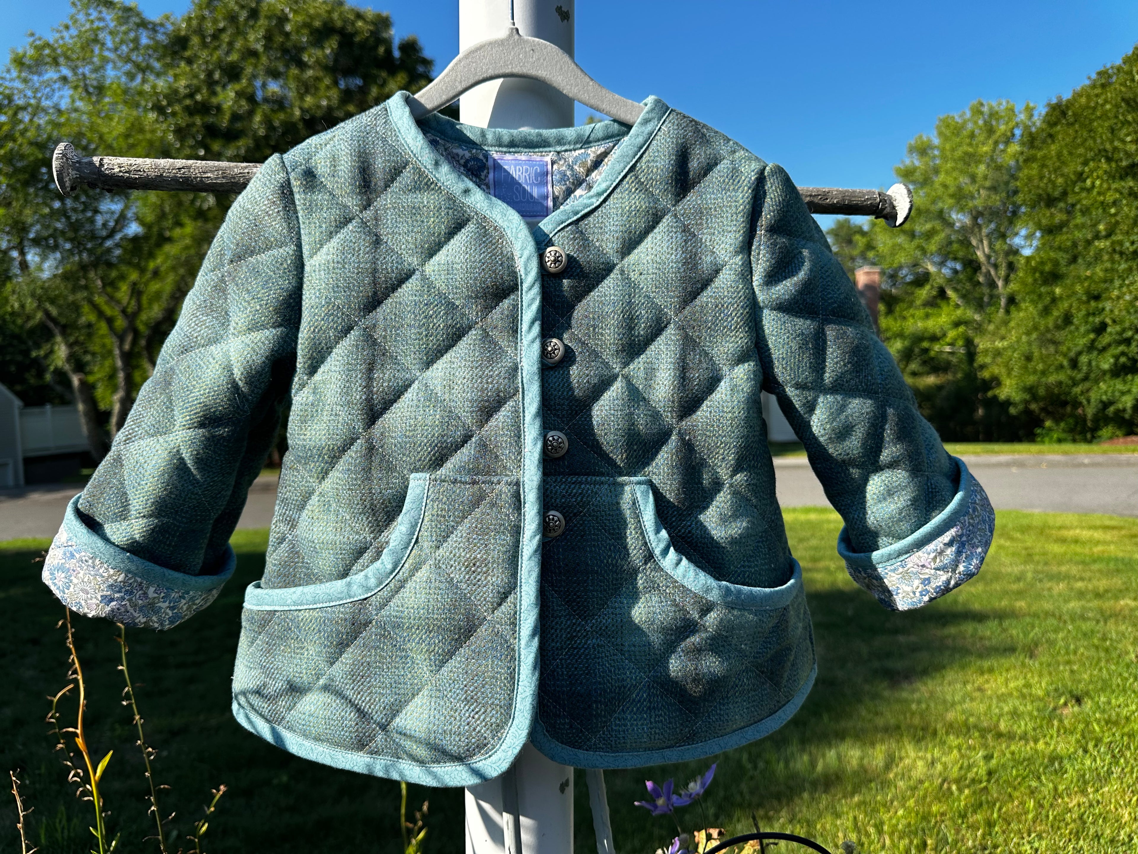 Scottish Wool Quilted Jacket Liberty of London Lined Toddler Size 3T – front view on hanger outdoors