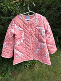 The Chatham Quilt daughter's coat — second front view showing Fabric & Soul label and button detail. Upcycled vintage estate sale quilt, children's size 6/7.
