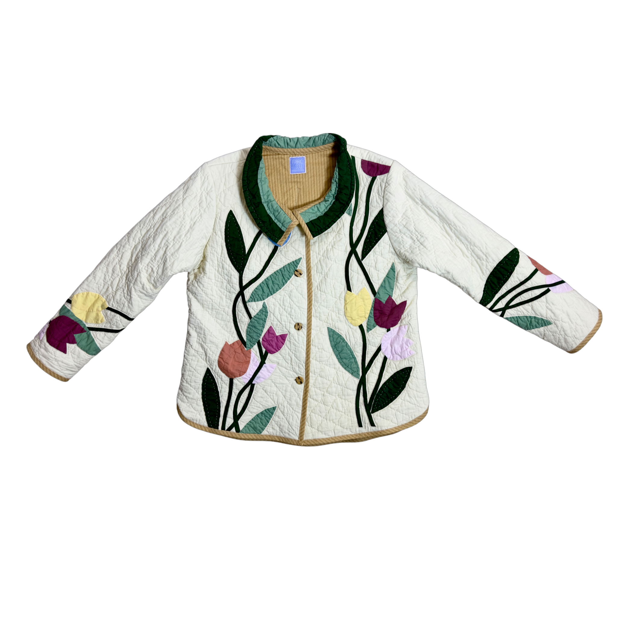 Adult wearing Blooms & Basket quilted jacket with floral design