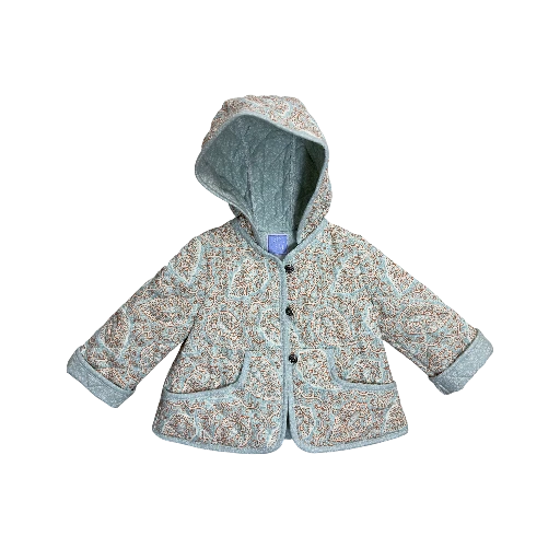 Child wearing designer quilted jacket with paisley pattern
