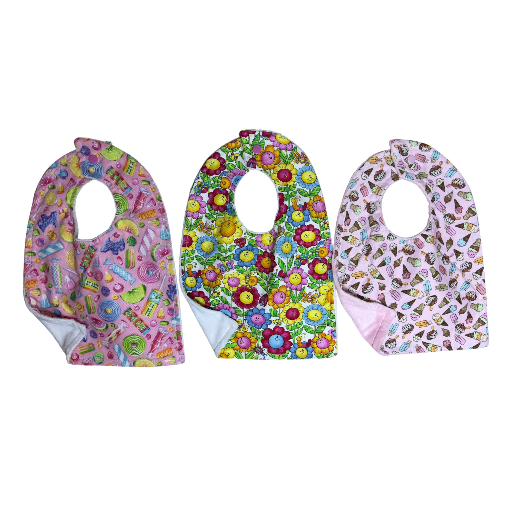 Handmade baby bib set of three with colorful candy, smiling flowers, and ice cream treats on quilting cotton with soft backing