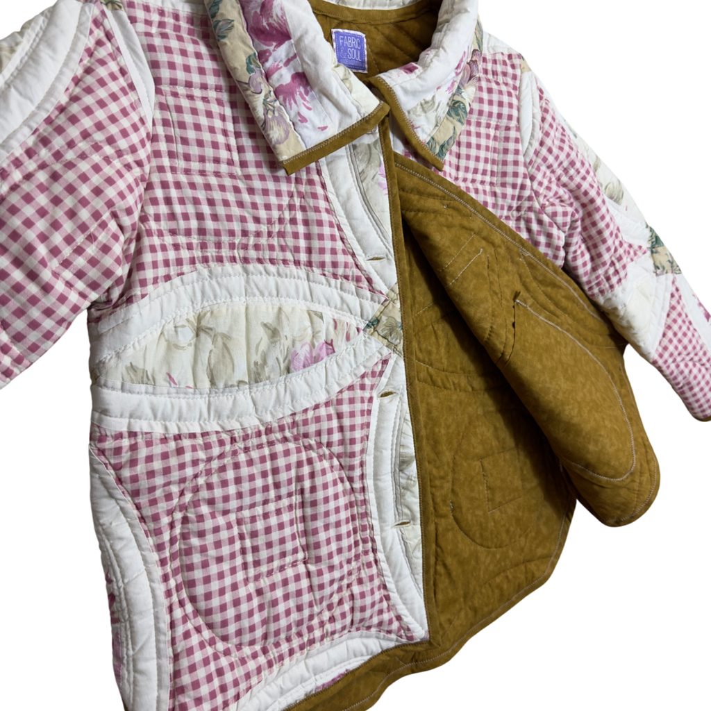Quilted jacket with pink and white checkered pattern and brown accents on a white background including the inside pocket detail and brown lining