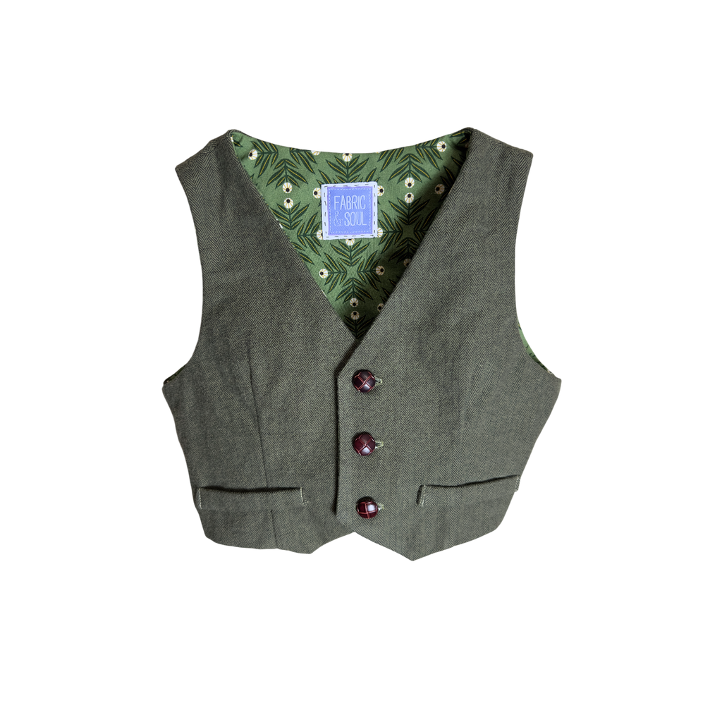 Green vest with decorative leather looking buttons and cotton lining