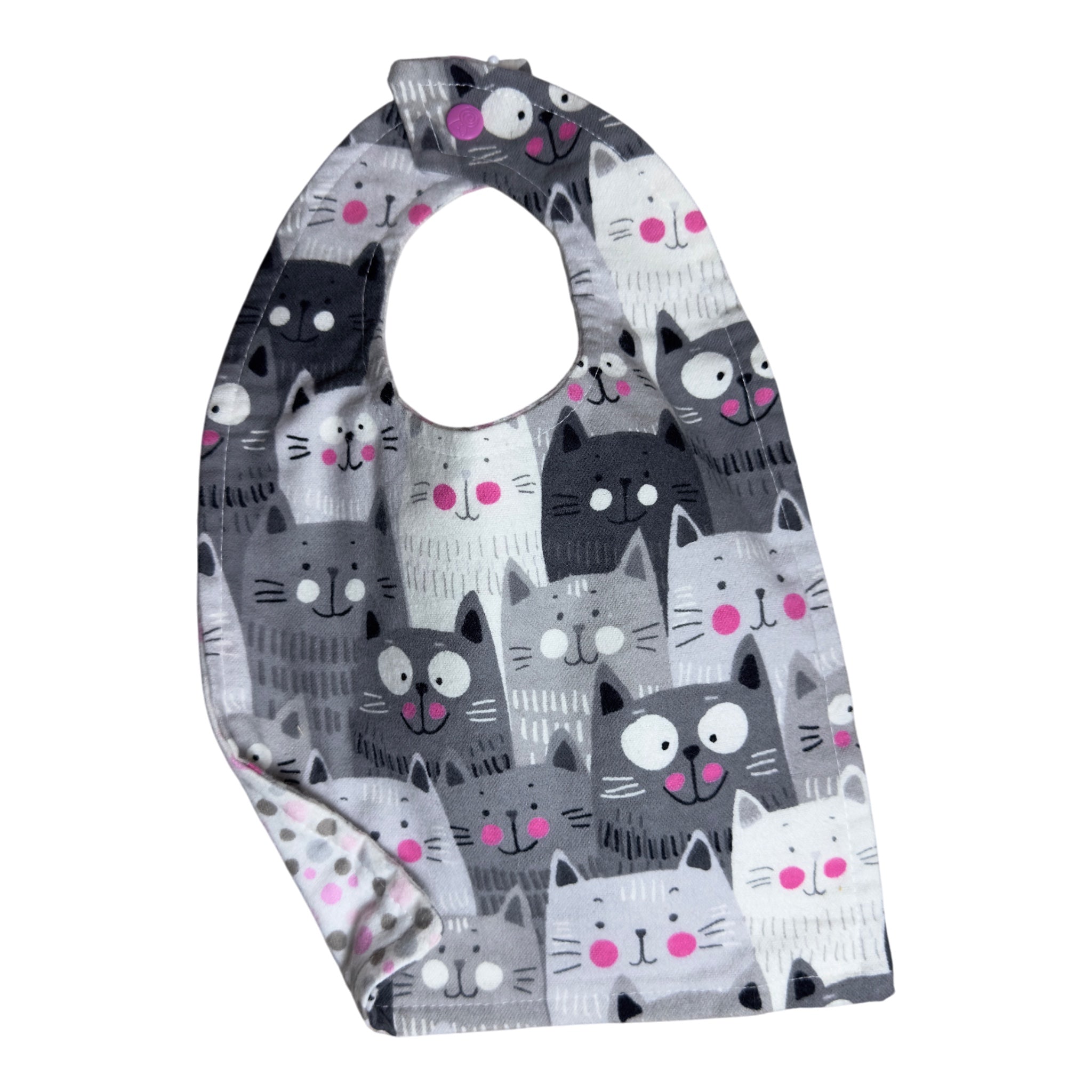 Handmade baby bib with happy cats design and pink snap with pink and grey polka dot flannel backing