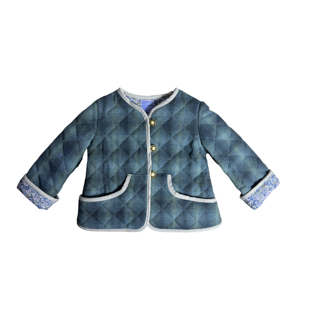 Child wearing Scottish wool jacket with Liberty fabric lining