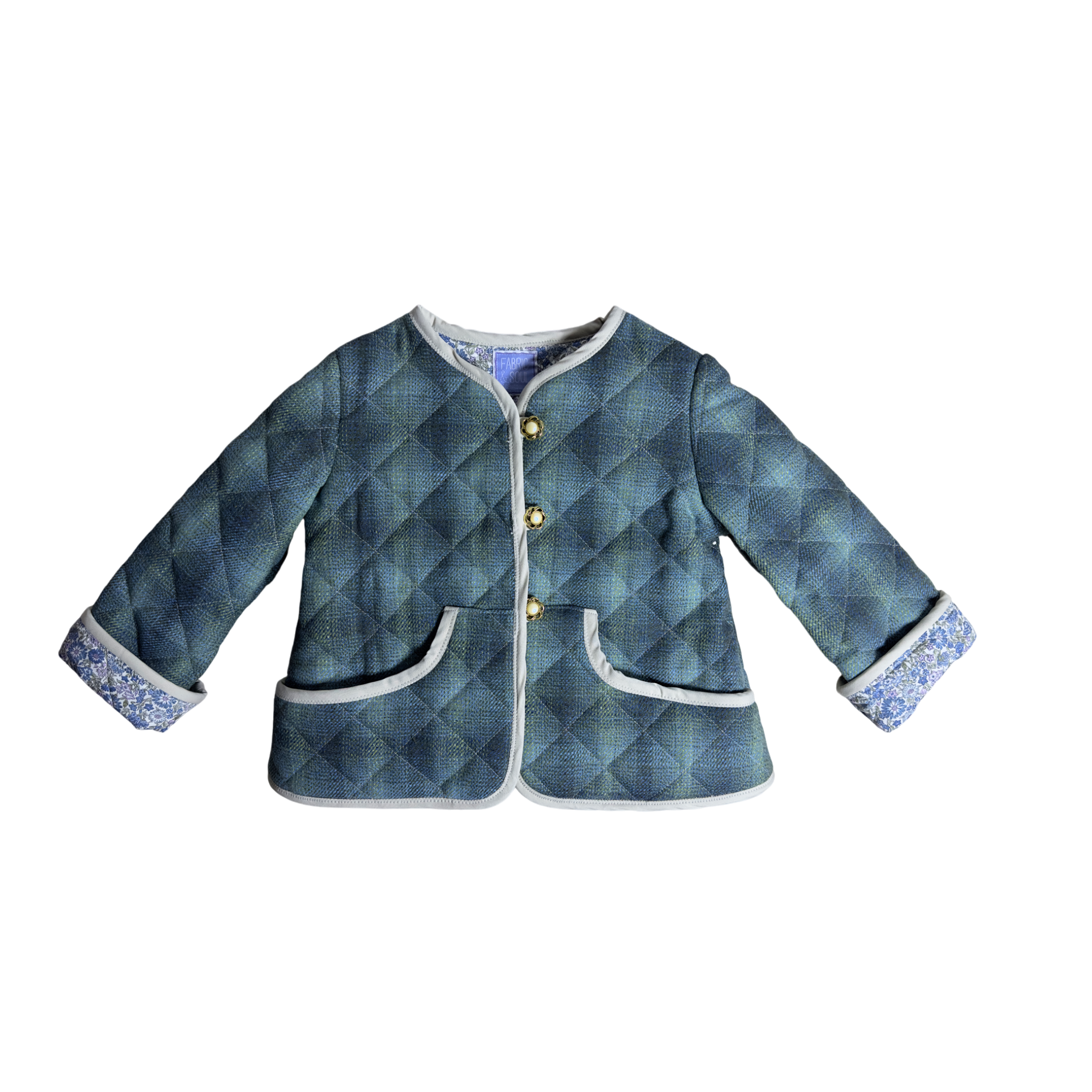 Child wearing Scottish wool jacket with Liberty fabric lining