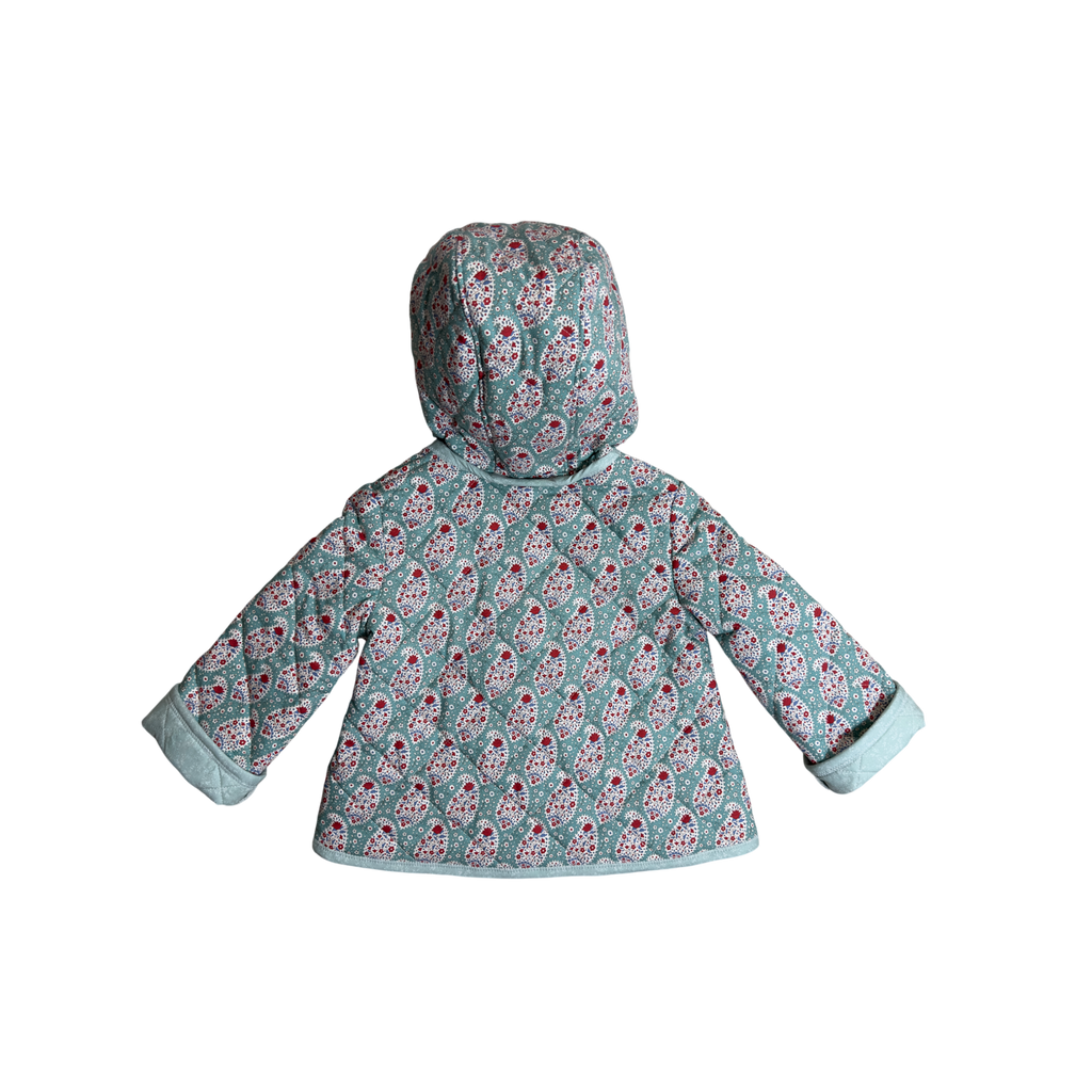 Back view of hooded coat showing paisley pattern and quilting