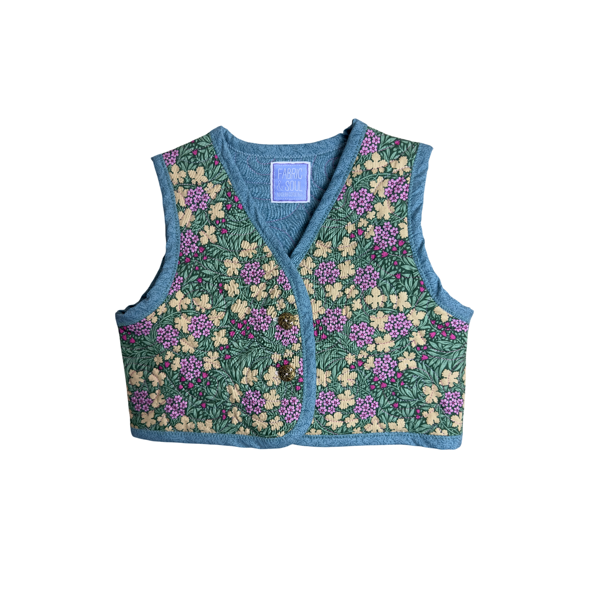 Front view of vest with gold colored buttons 