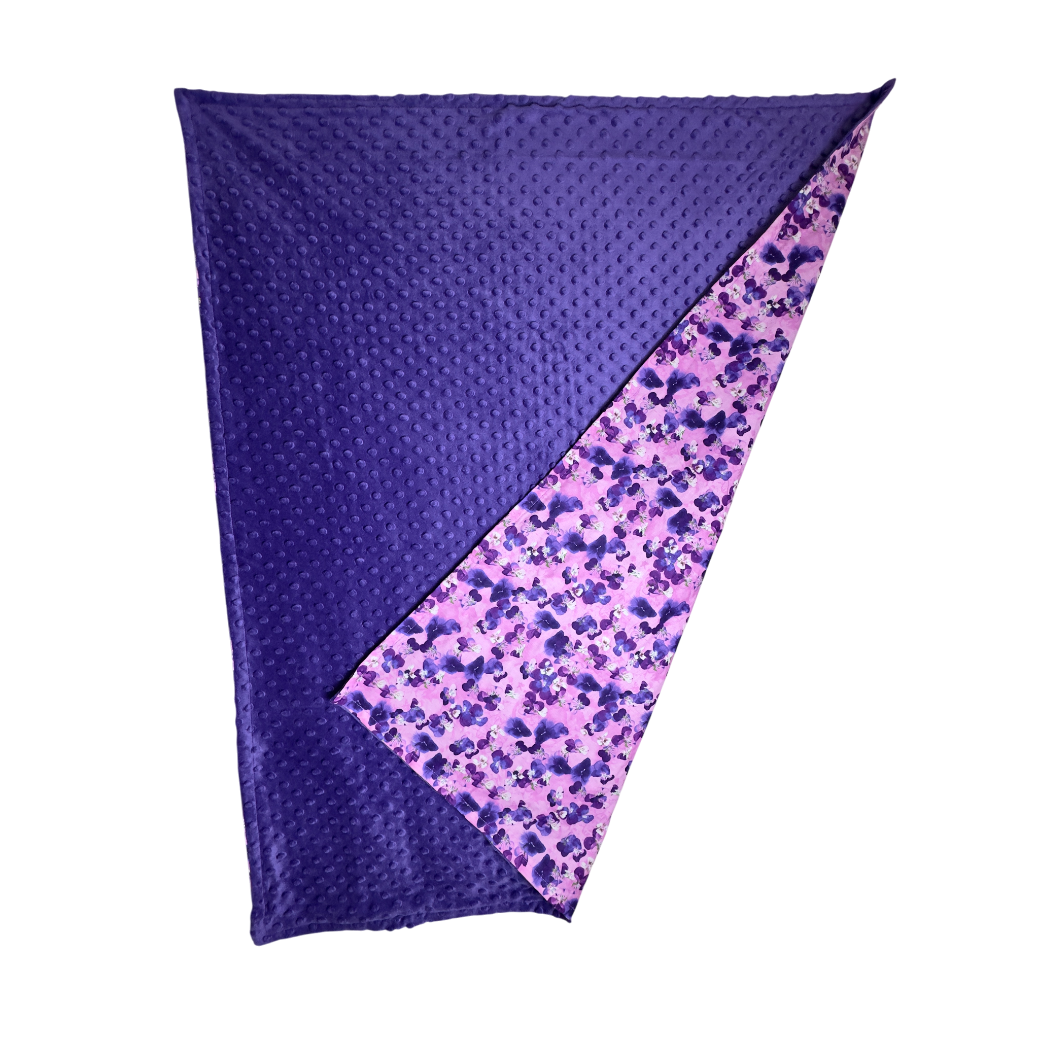 Handmade baby blanket with vibrant pink and purple cotton print and soft dotted minky backing