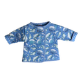 Front view blue quilted coat with narwhal print