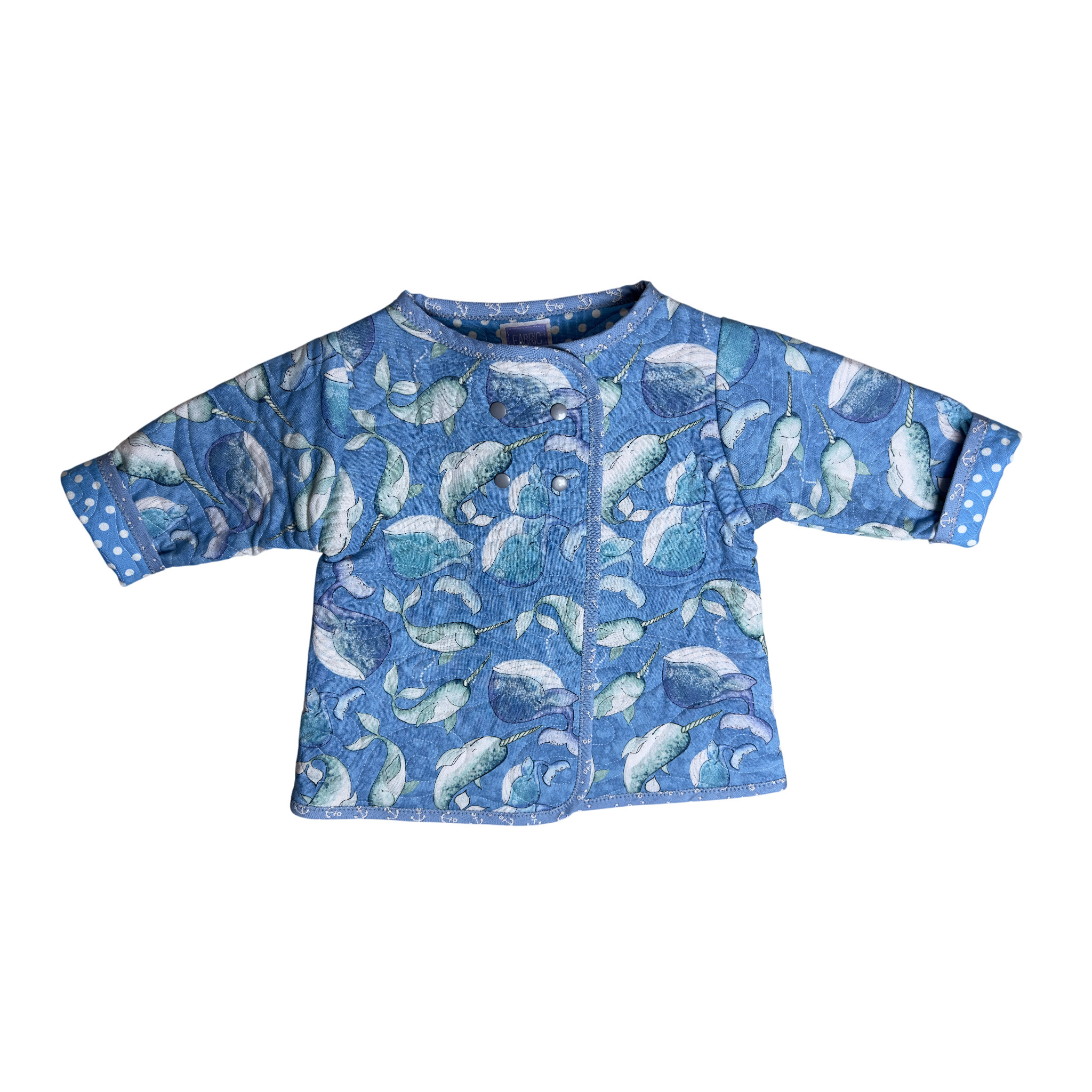 Front view blue quilted coat with narwhal print