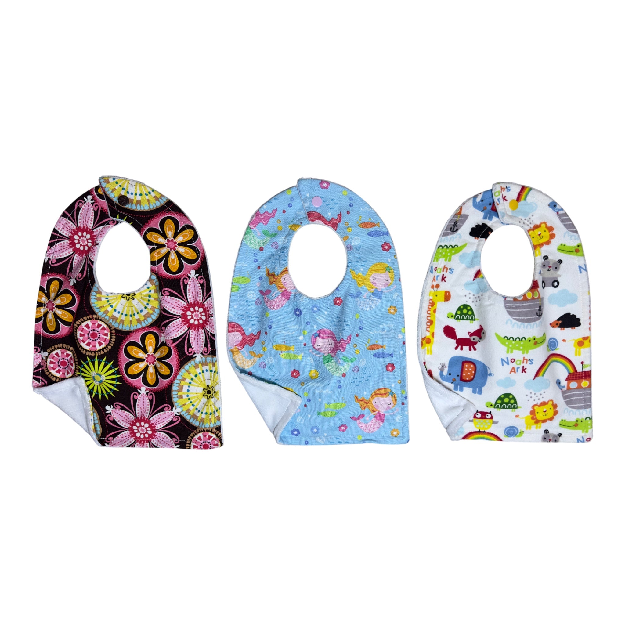 Handmade baby bib set of three with modern flowers, swimming mermaids, and Noah's Ark animals on quilting cotton with soft backing