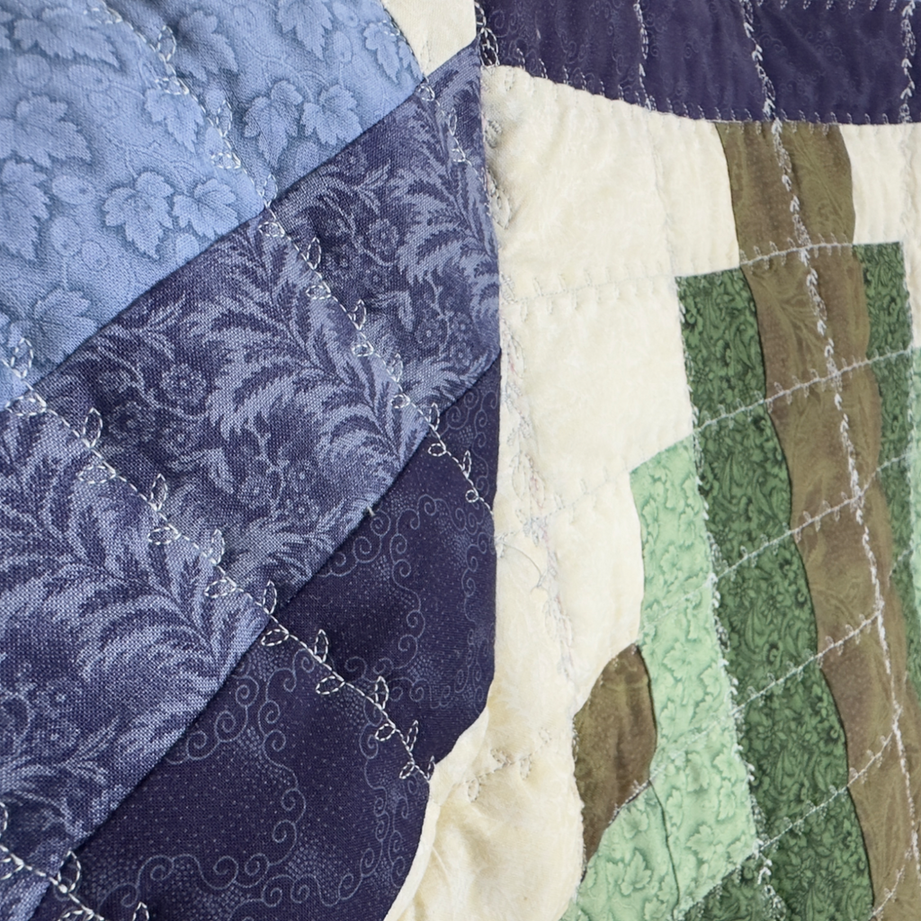 Close-up of geometric quilting, top stitching and fabric detail. 