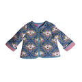Child wearing Dancing Flowers quilted coat with floral design