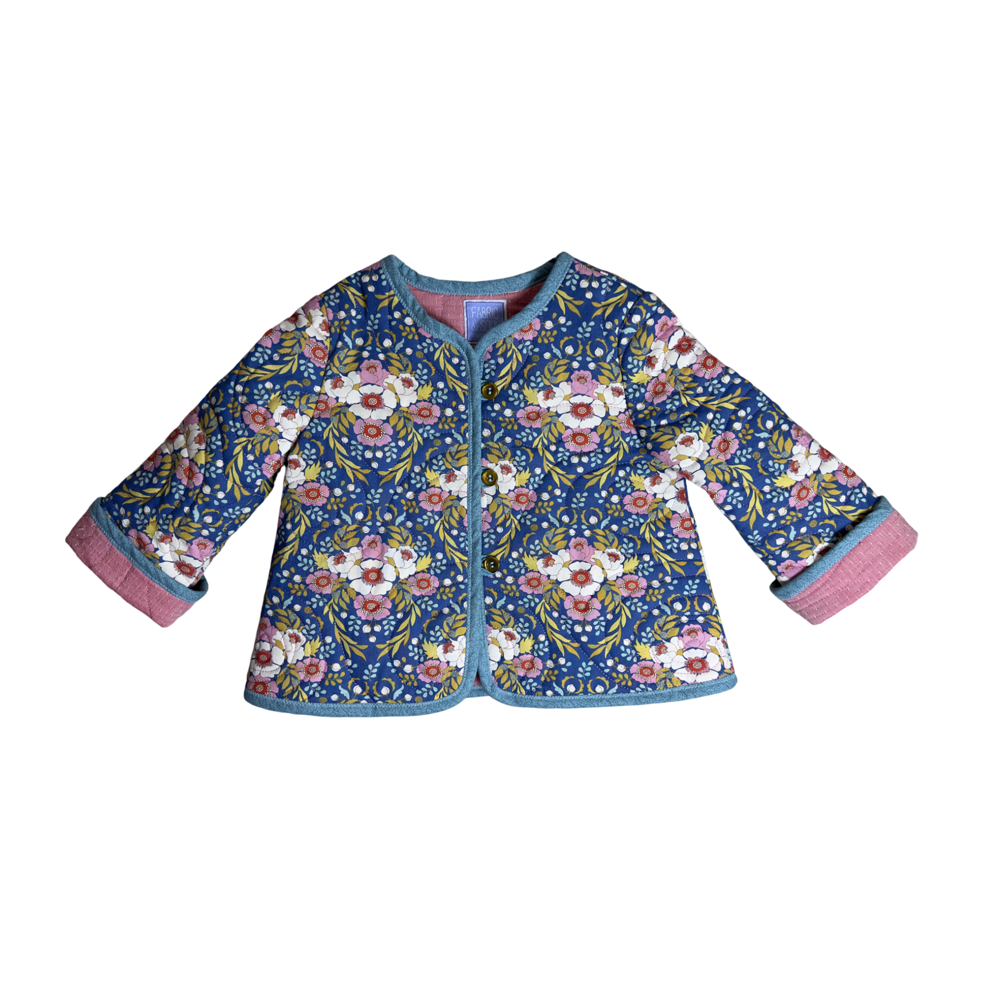 Child wearing Dancing Flowers quilted coat with floral design