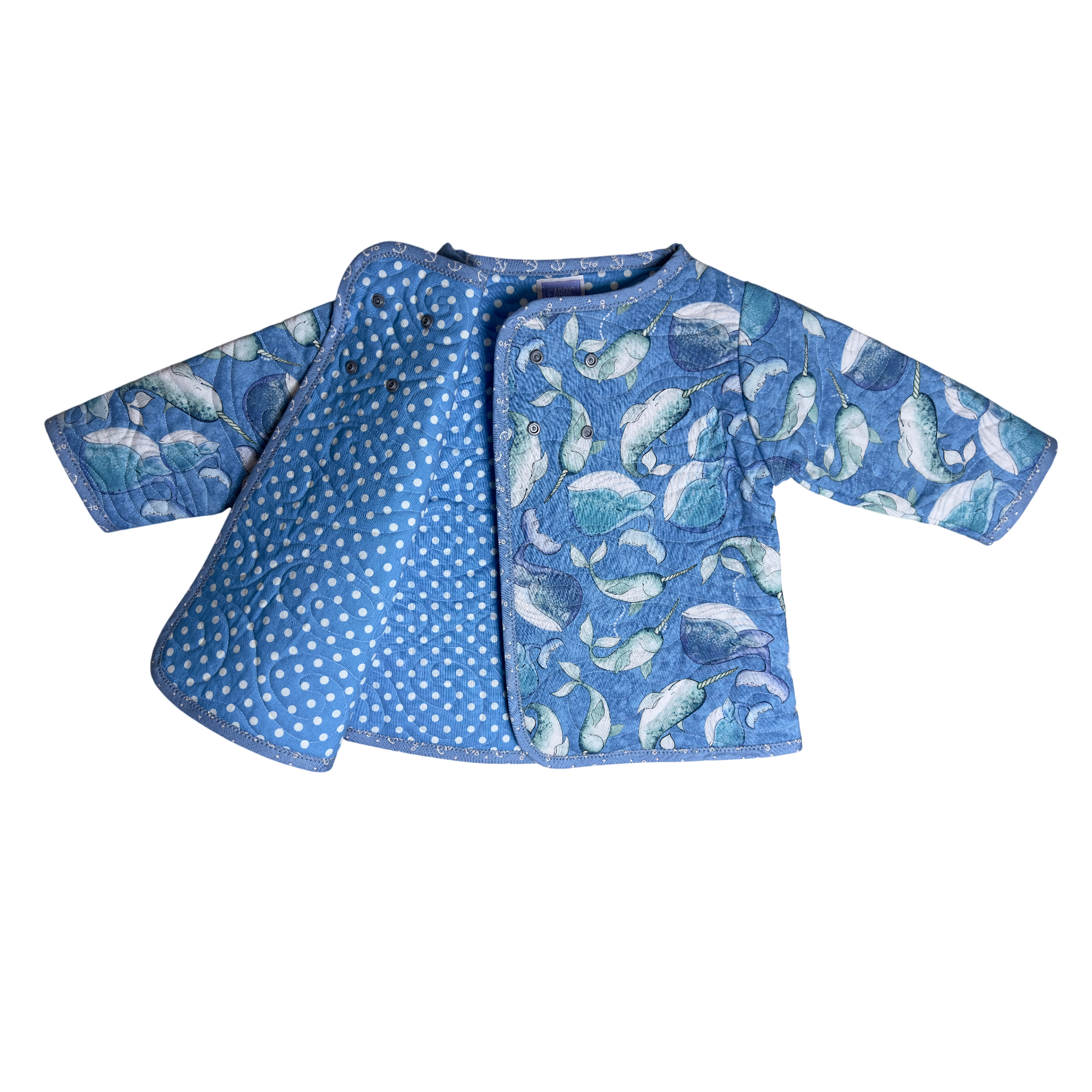 Wrap and snap Blue Narwhal Voyage Coat with polka dot lining
