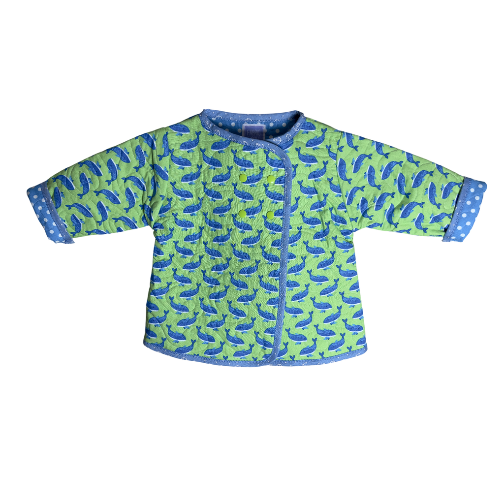 Front view of wrap and whale watcher snap coat in green sea edition