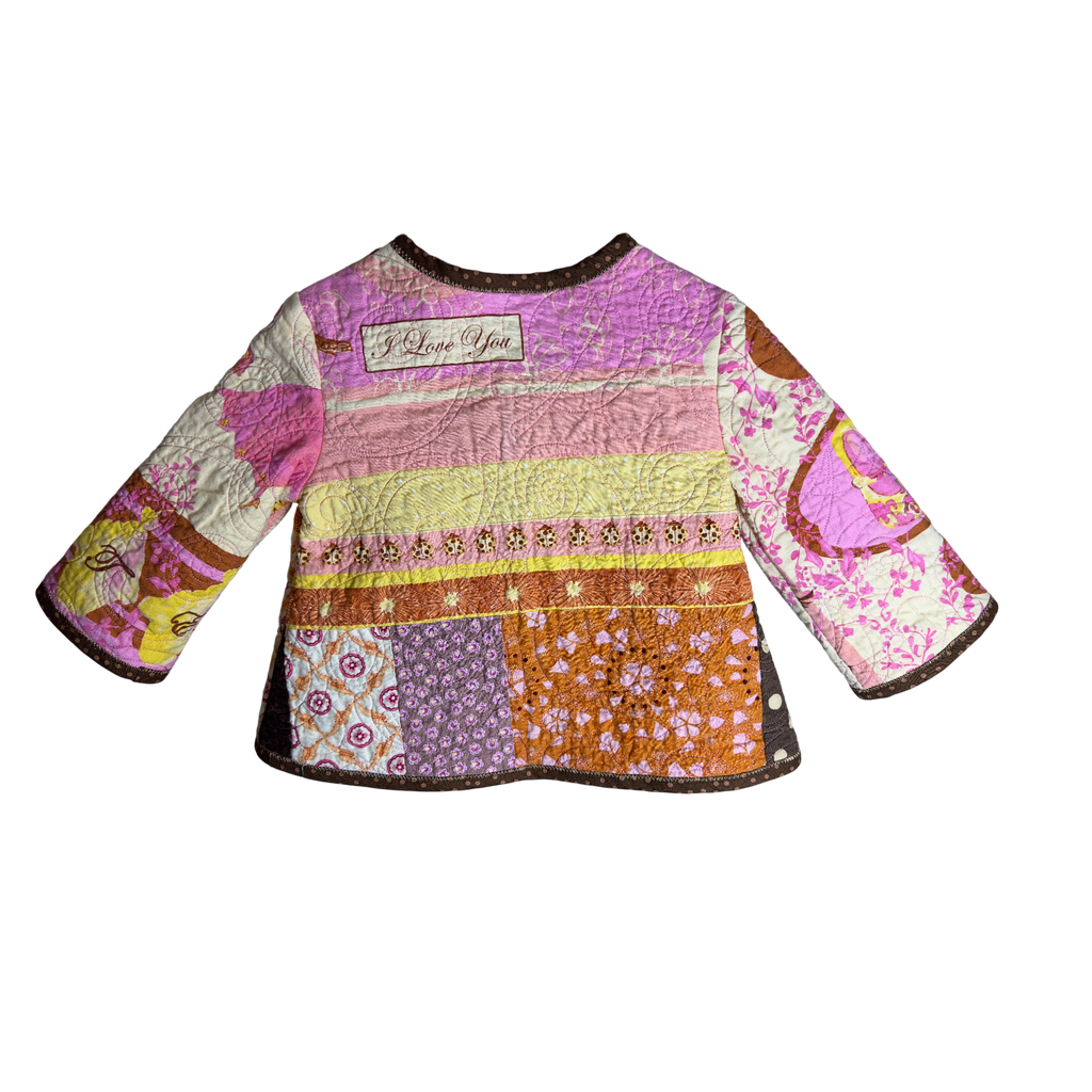 Upcycled quilt patchwork jacket with colorful design and message on back